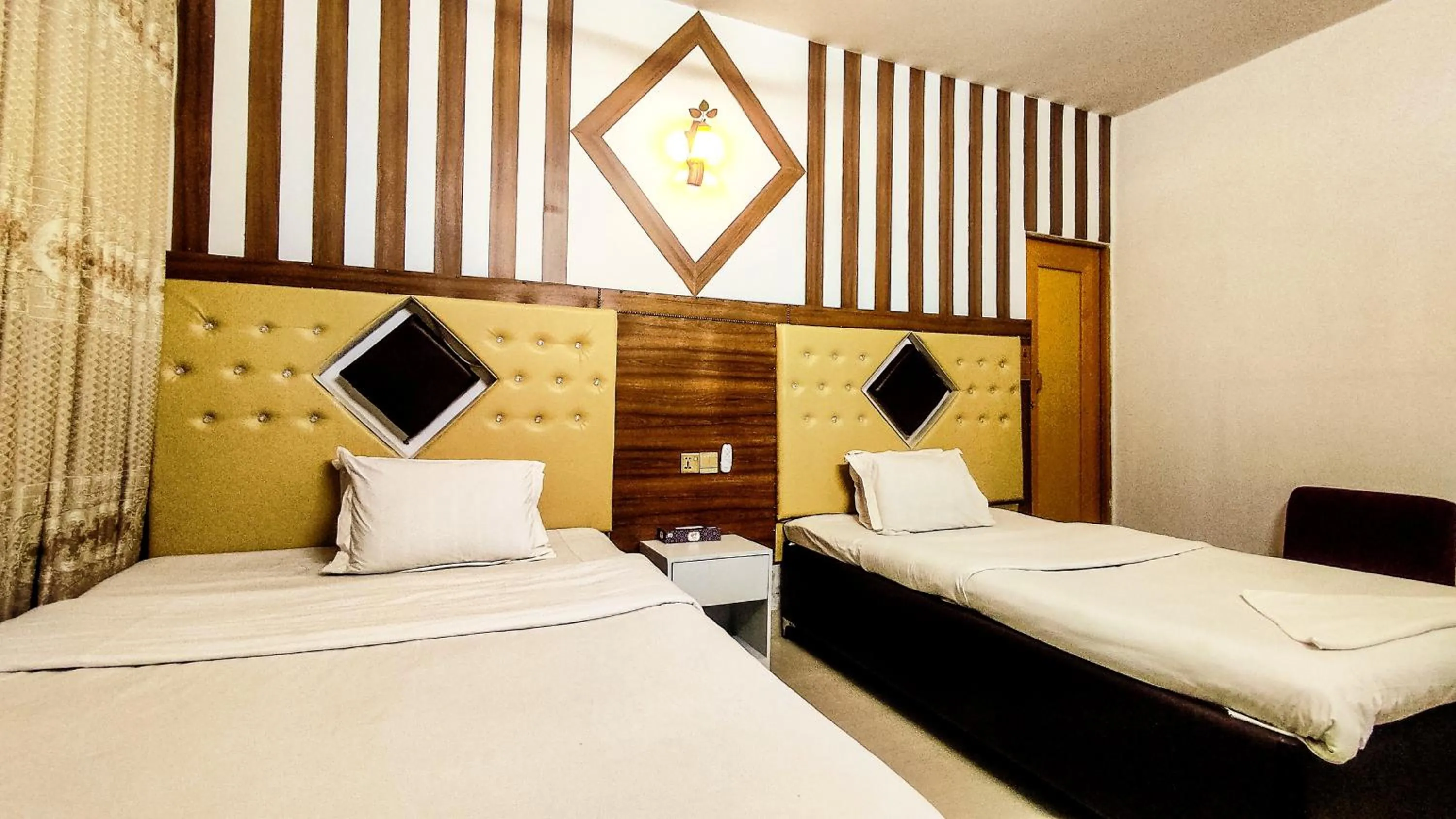 Bed in White Rose Suites Ltd