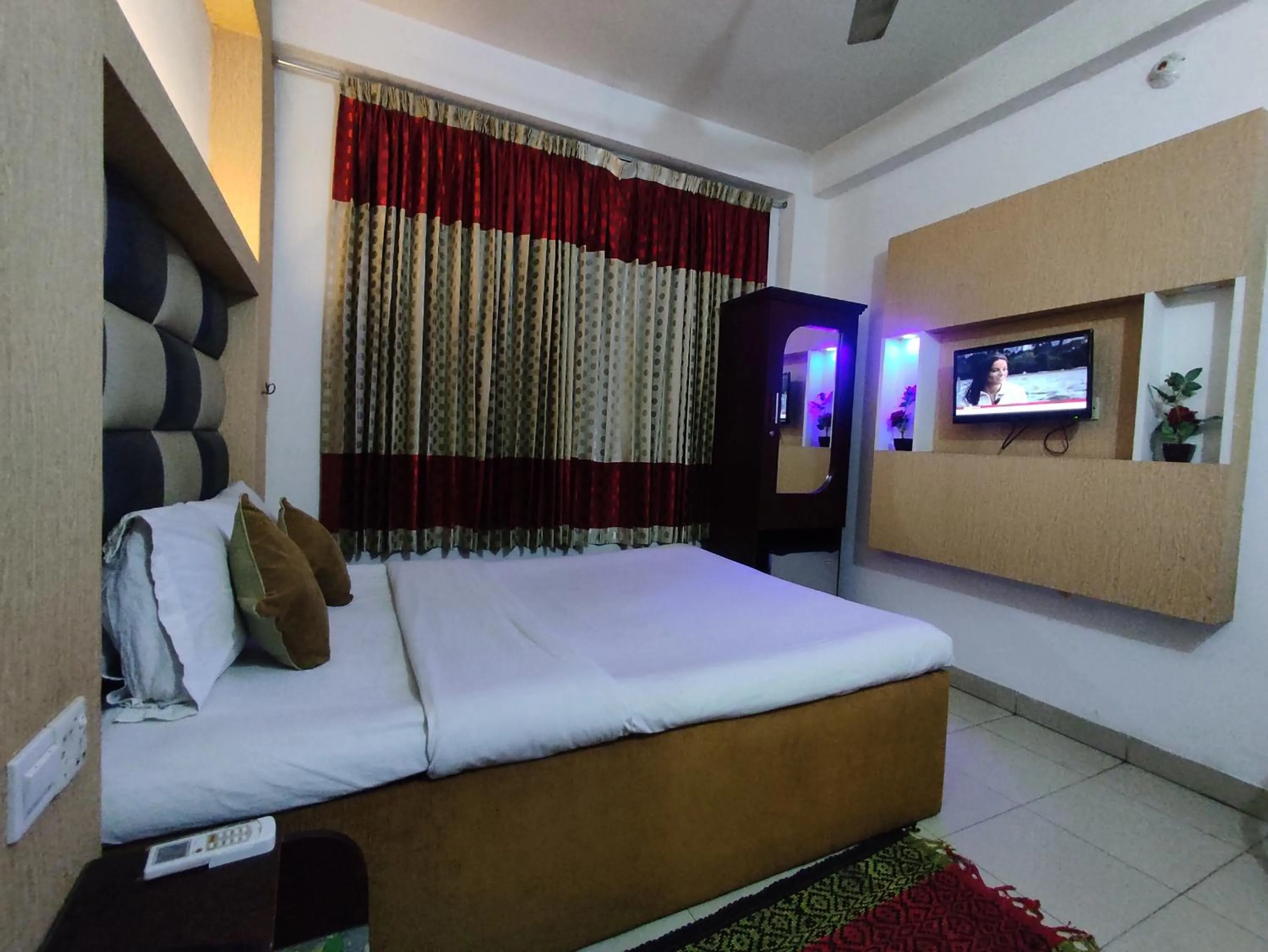 Bed in White Rose Suites Ltd