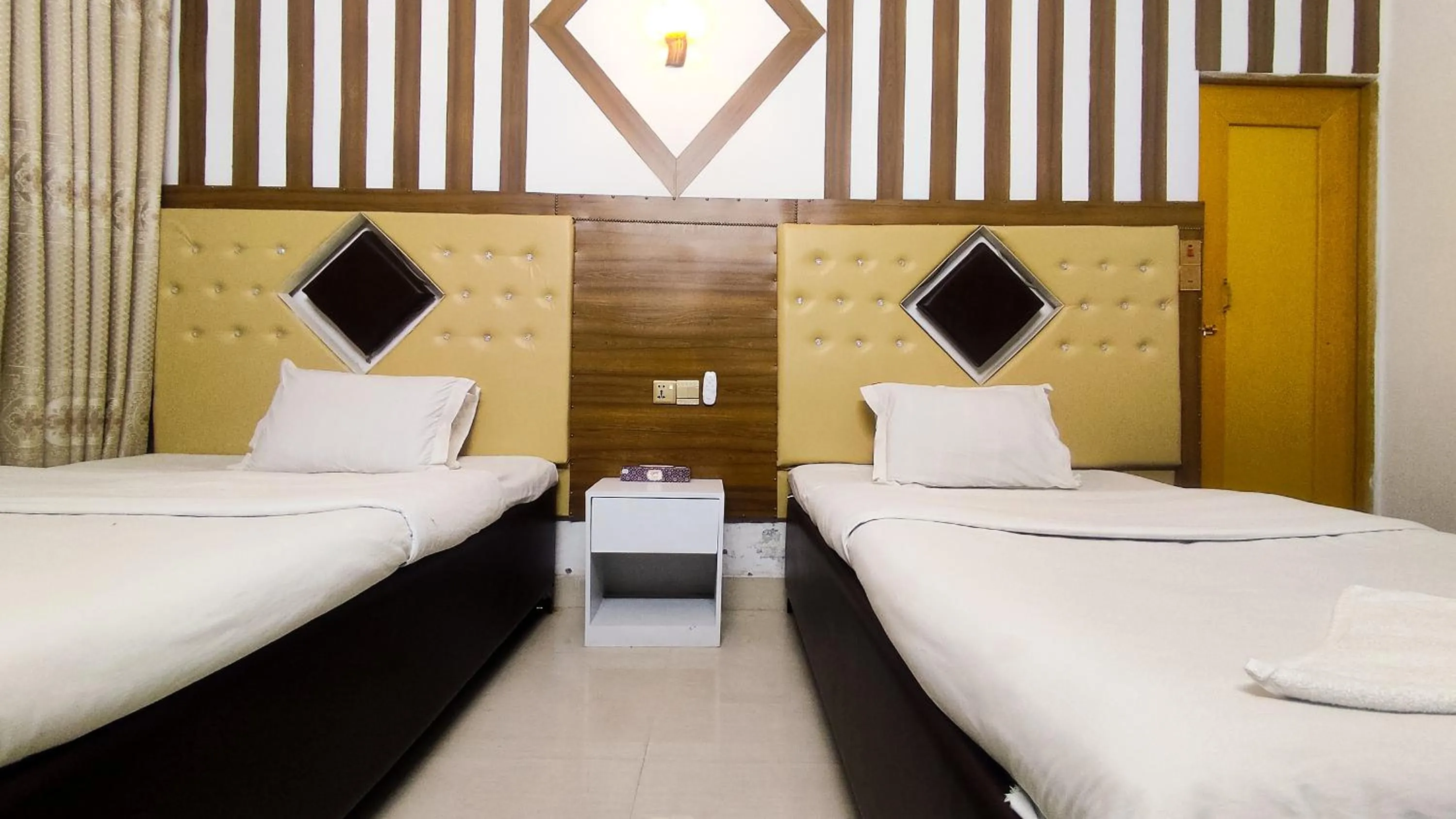 Bed in White Rose Suites Ltd