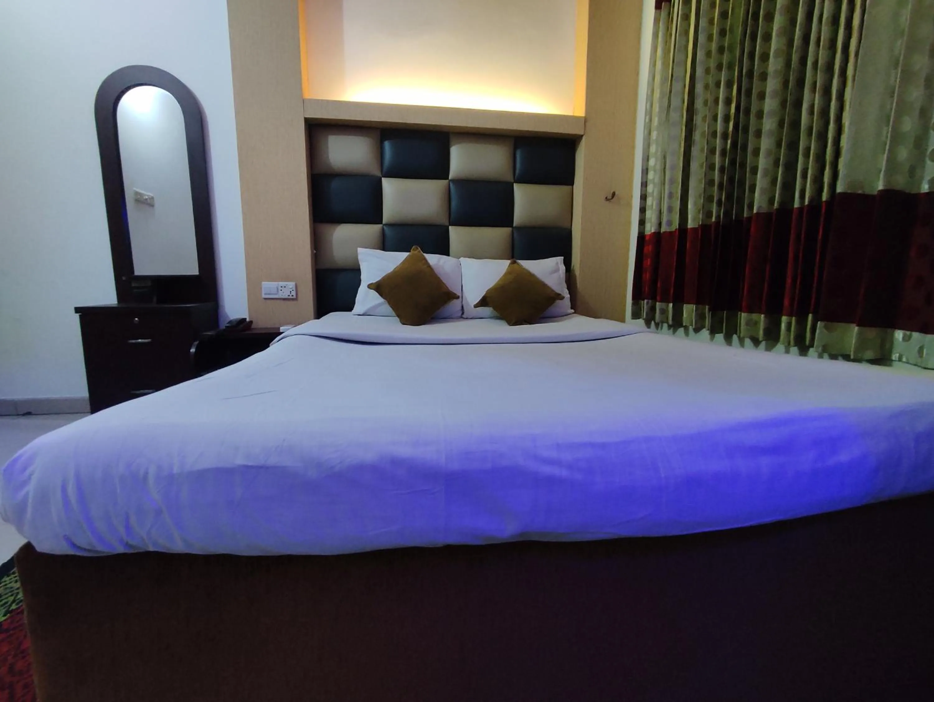 Bed in White Rose Suites Ltd