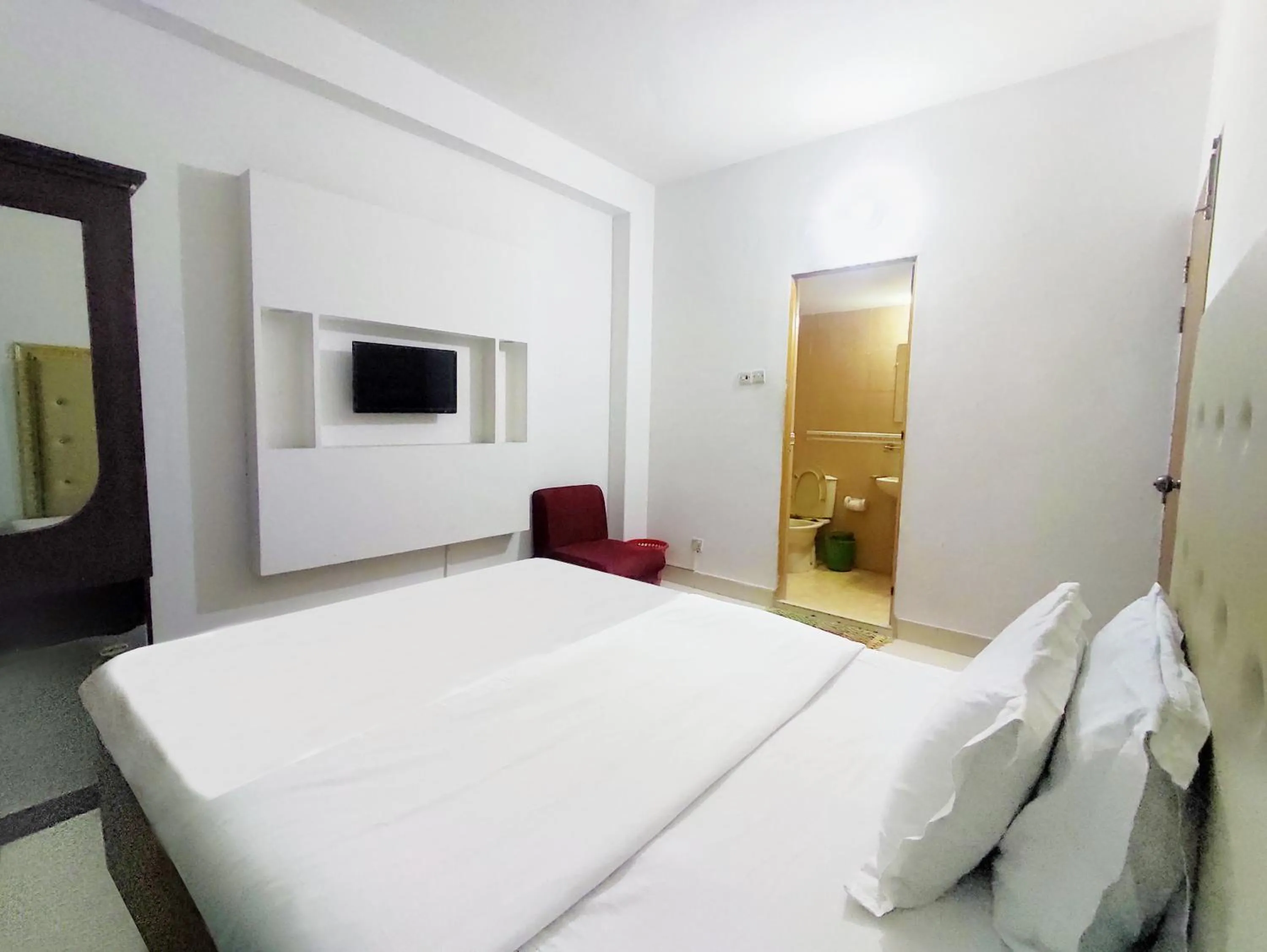 Bed in White Rose Suites Ltd