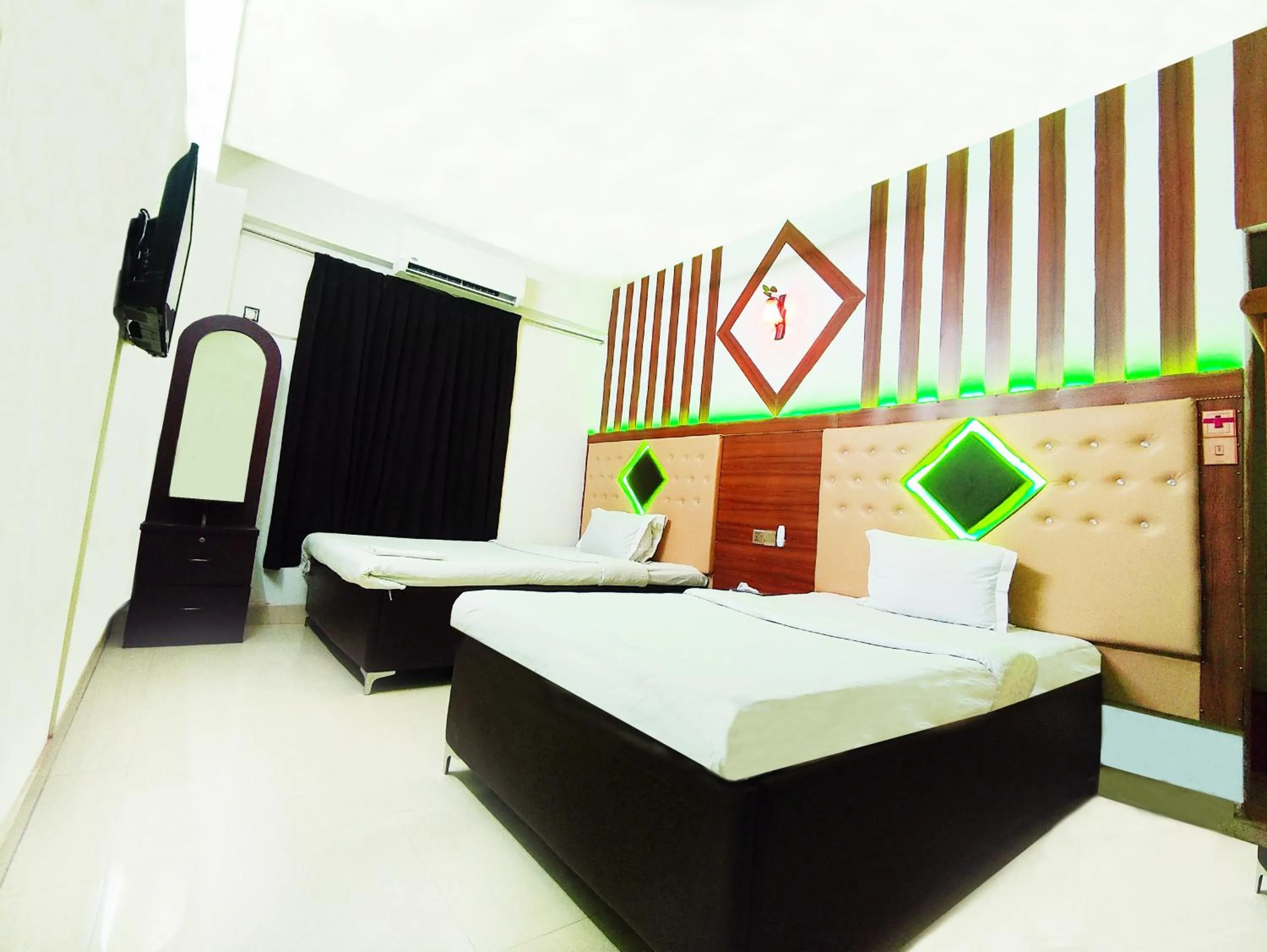 Bed in White Rose Suites Ltd
