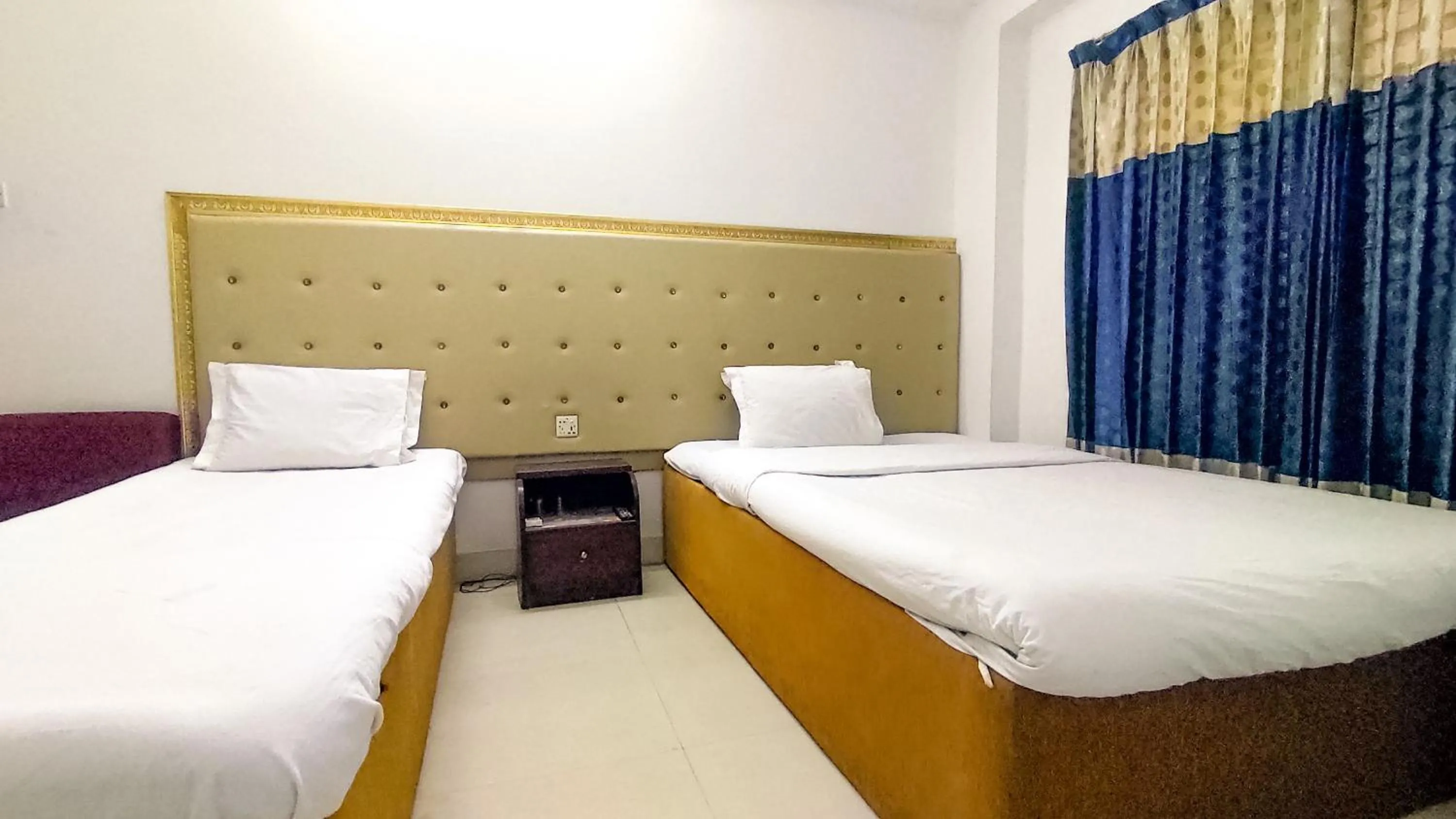 Bed in White Rose Suites Ltd