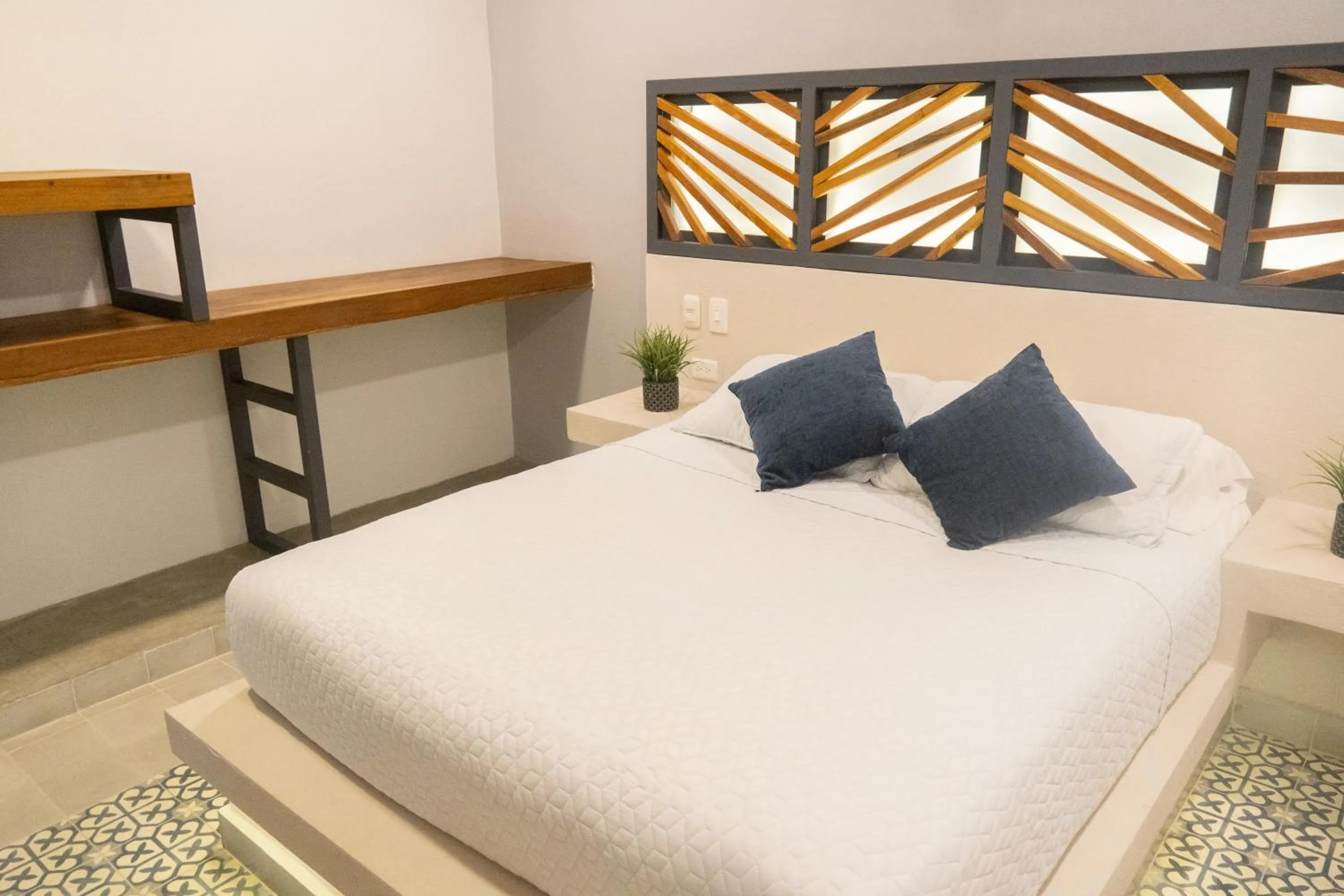 Bed in The Garden Suites