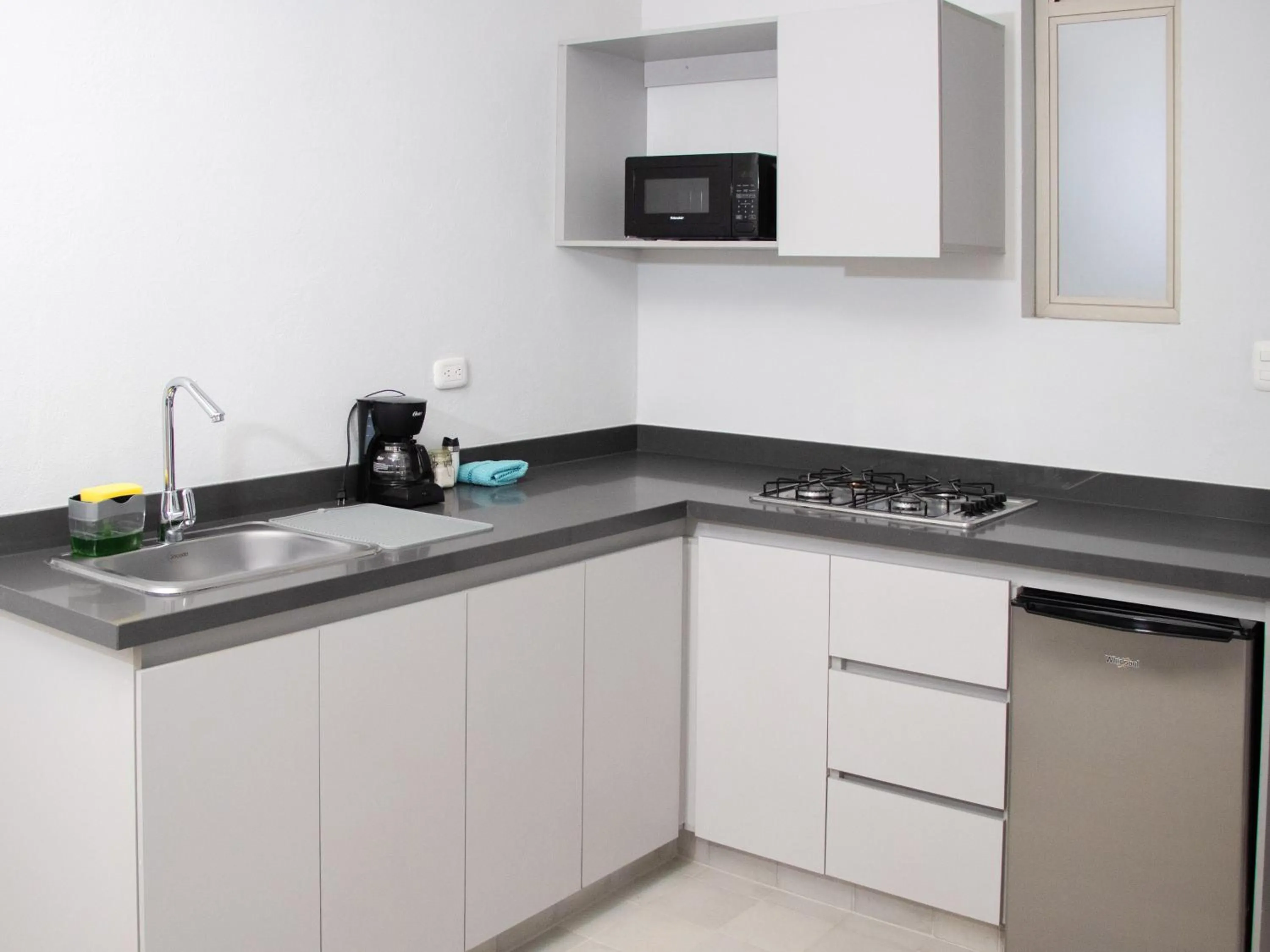 Kitchen or kitchenette in The Garden Suites