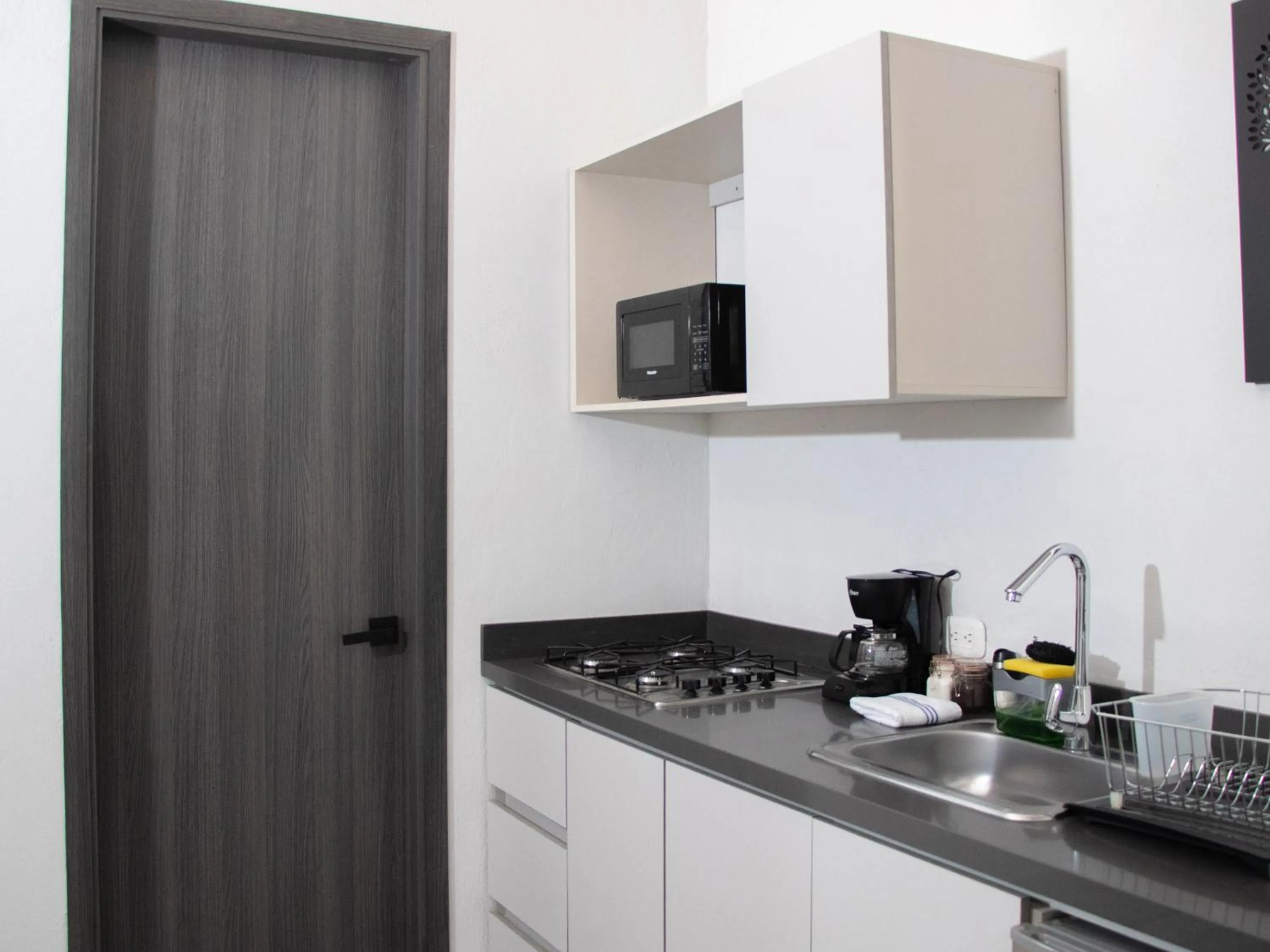 Kitchen or kitchenette in The Garden Suites