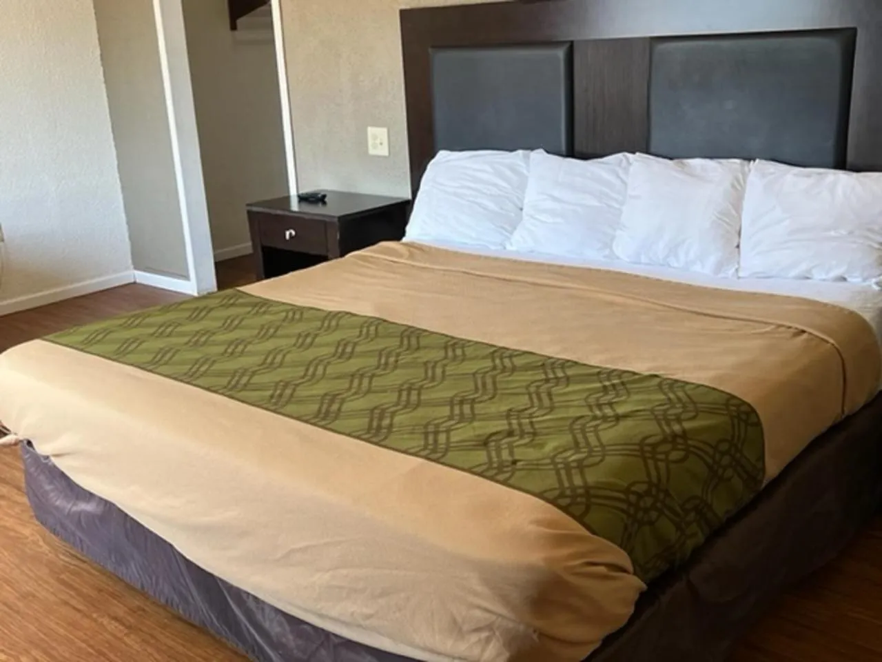 Bed in Posh Inn & Suites