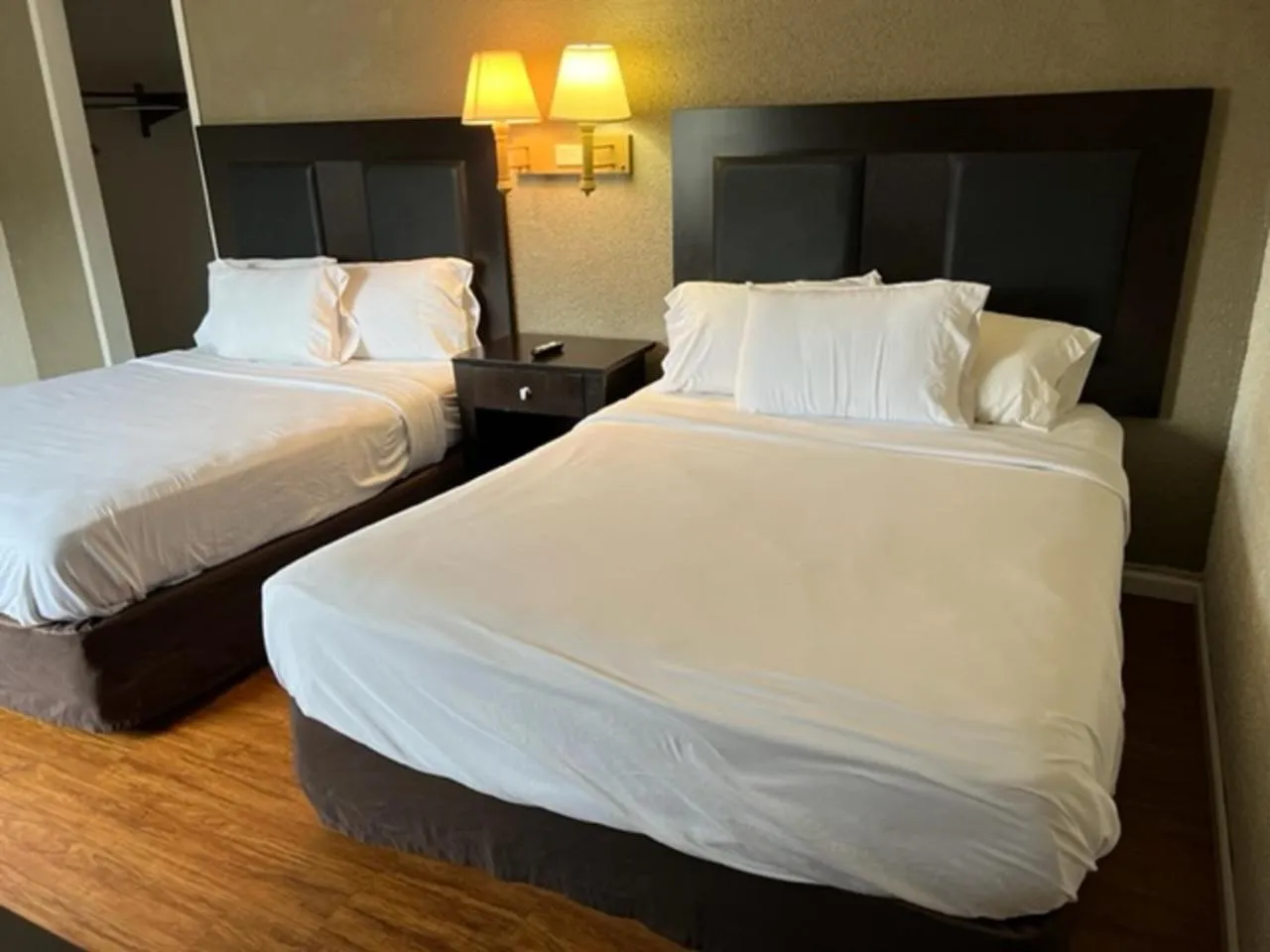 Bed in Posh Inn & Suites