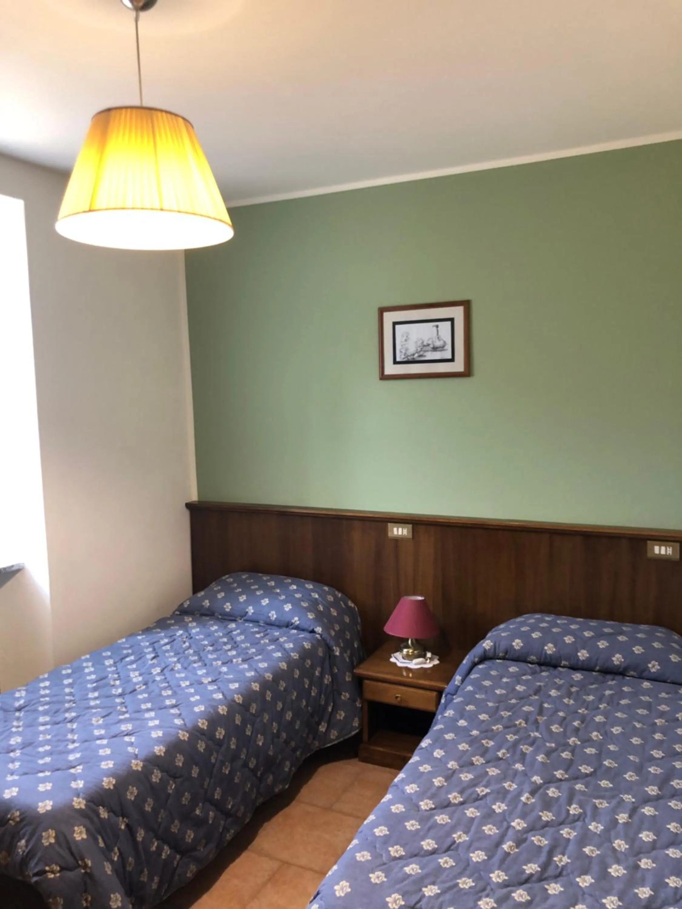 Bed in Albergo Miramonti