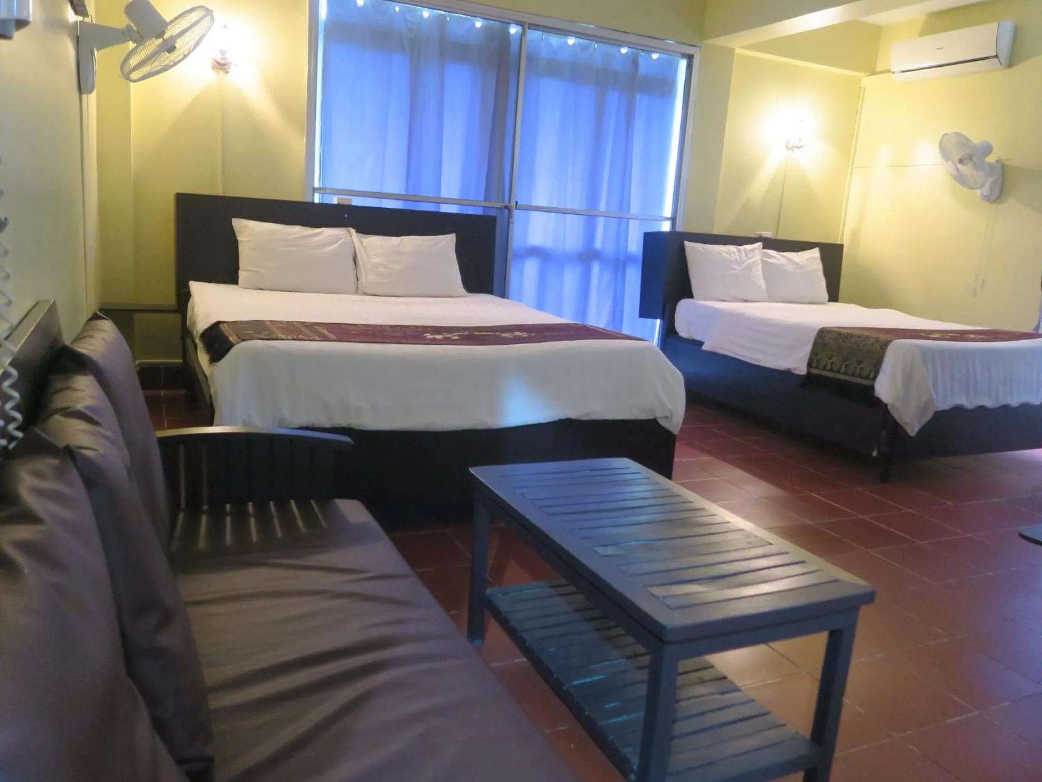 Bed in River Dolphin Hotel