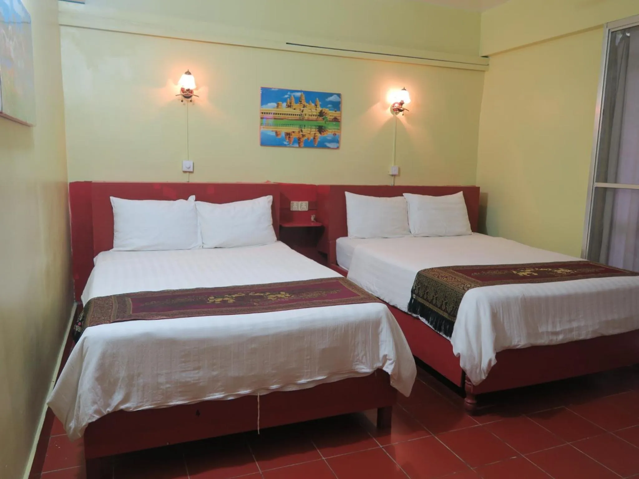 Bed in River Dolphin Hotel