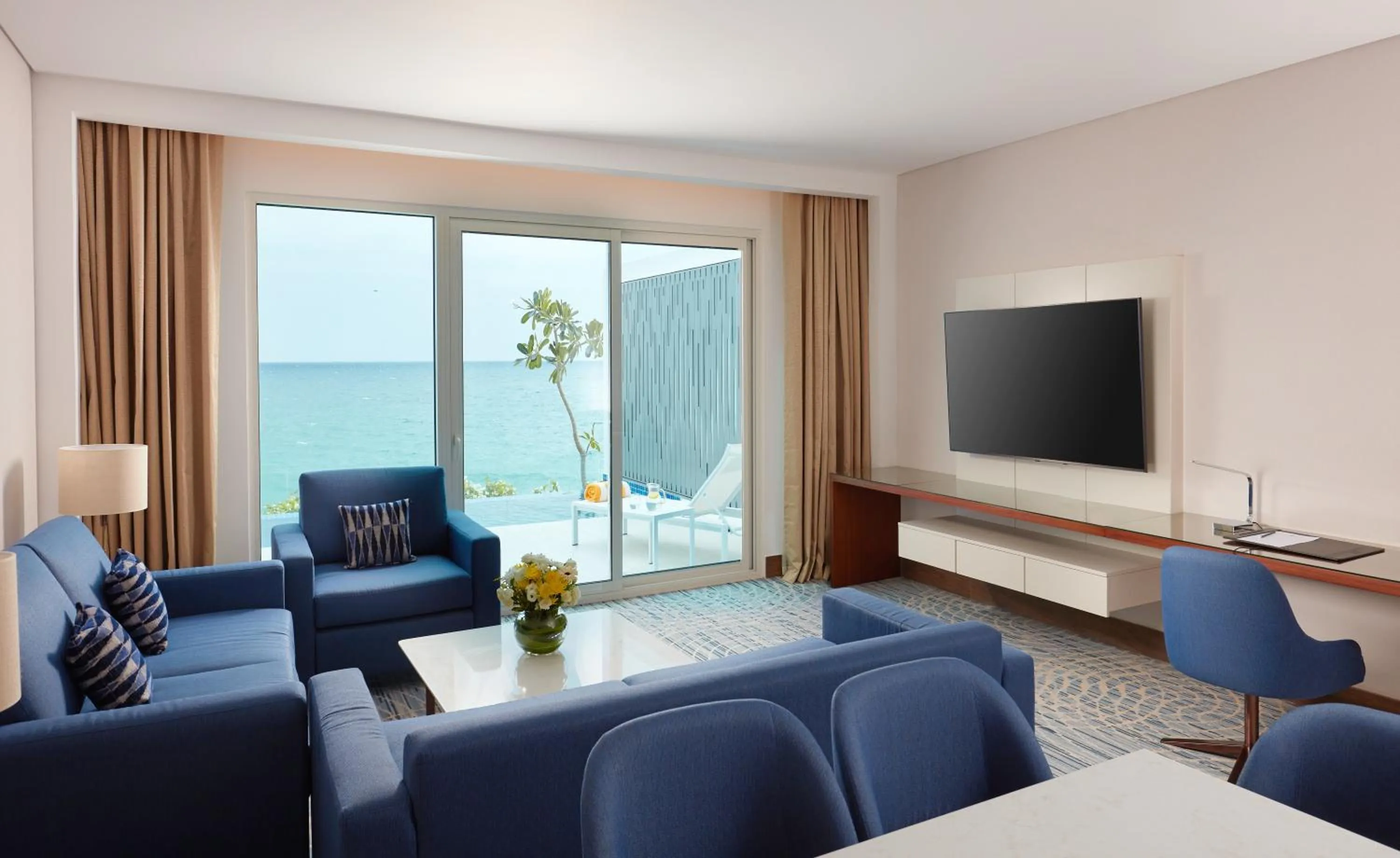 TV and multimedia in Royal M Al Aqah Beach Resort by Gewan