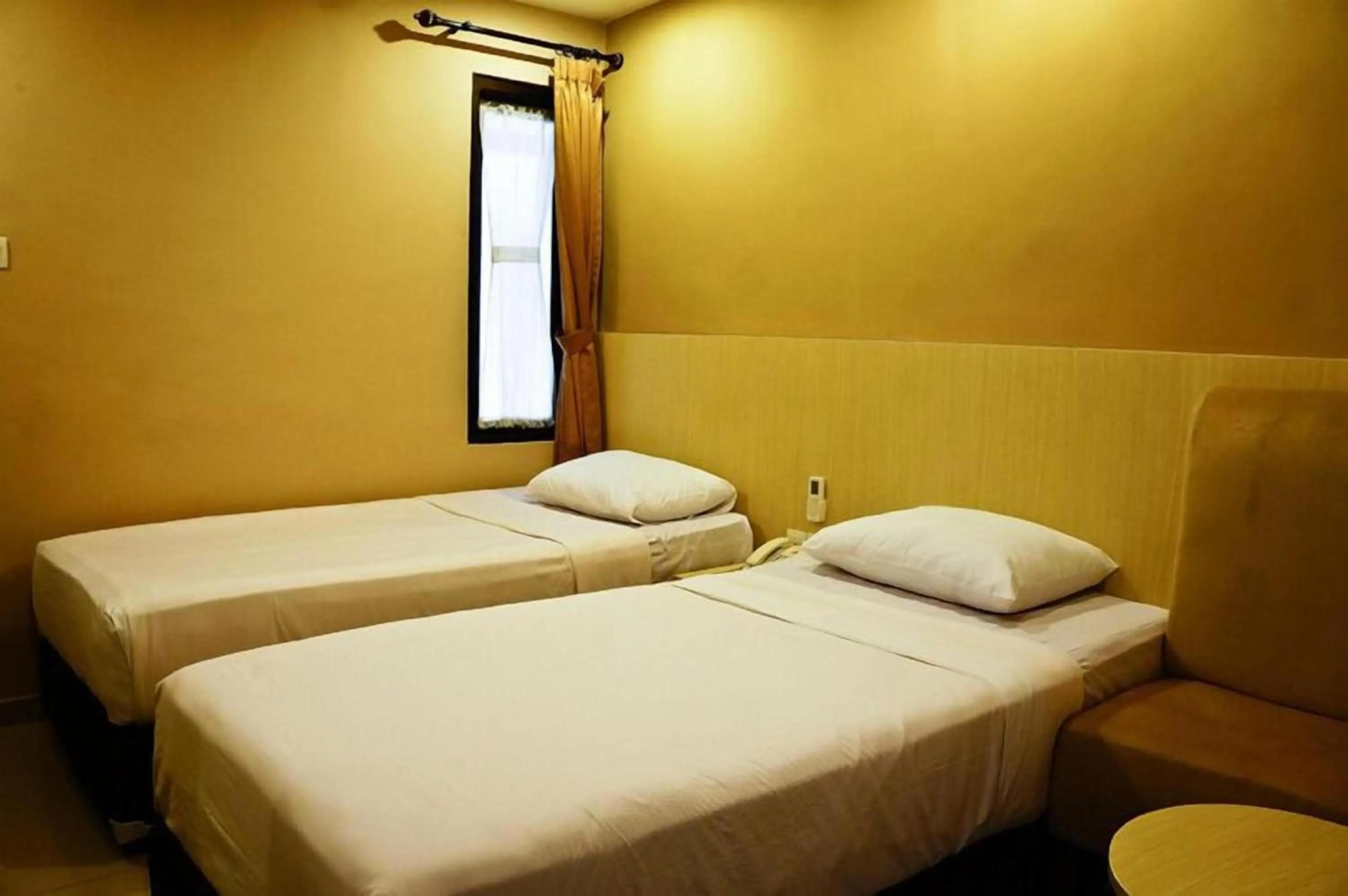 Photo of the whole room, Bed in Collection O Near Bajra Sandi Monumen Formerly Grand Pondok Puri Ayu