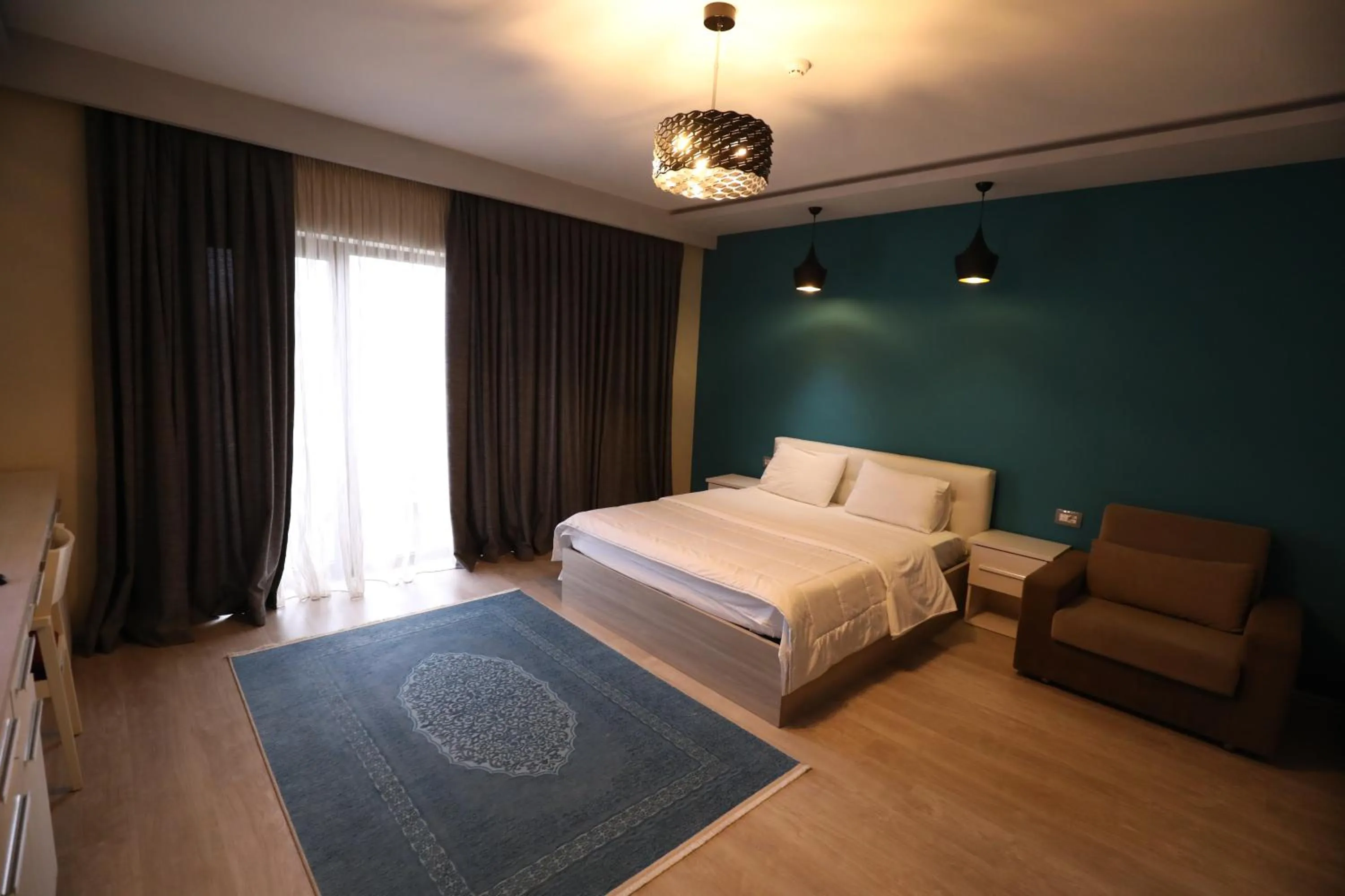 Living room, Bed in Hotel 1 Maji