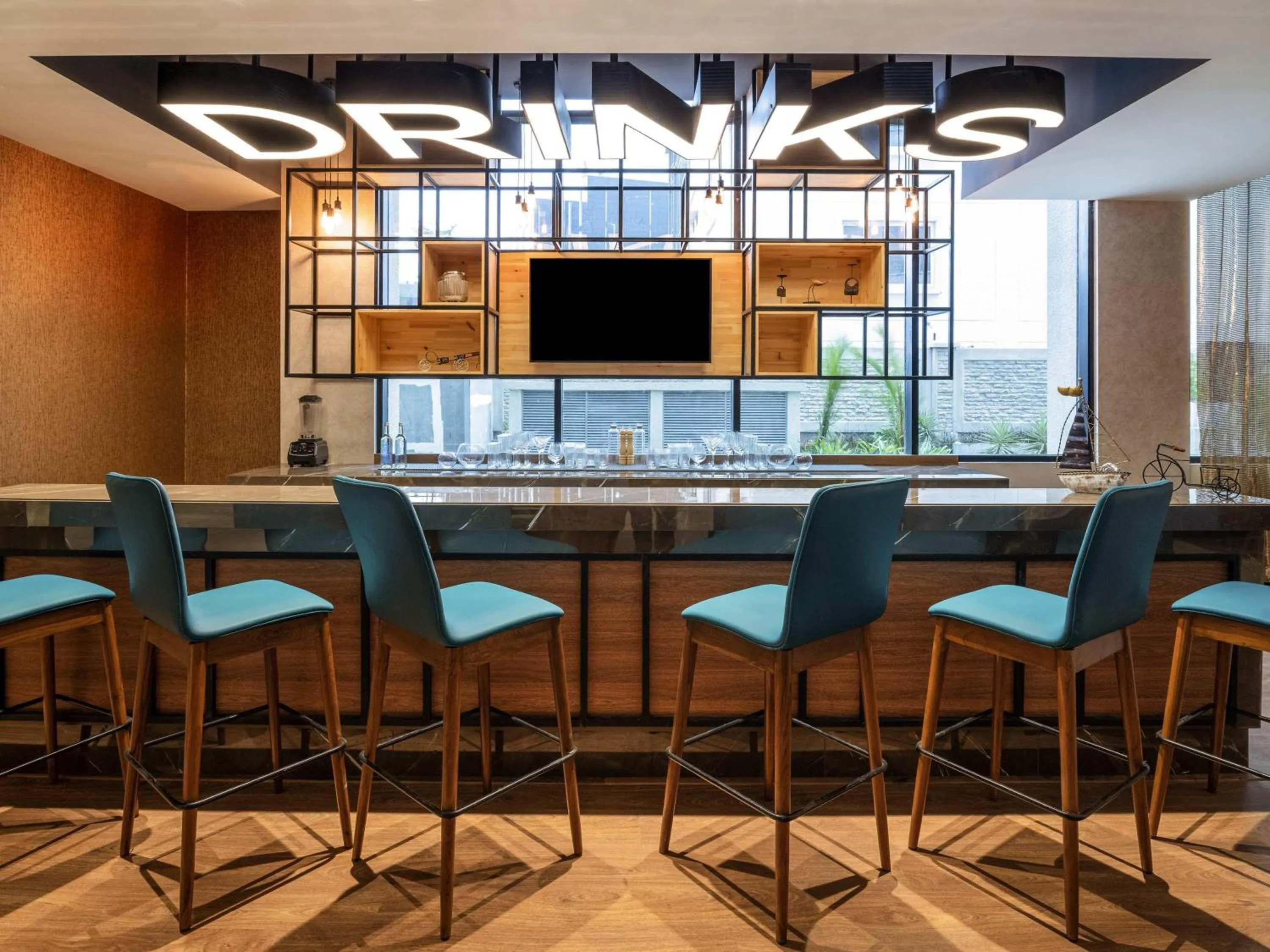 Lounge or bar in ibis Bengaluru Hebbal - An Accor Brand