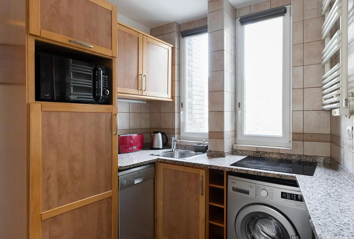 Kitchen or kitchenette in Appart Hôtel Résidence Courcelle