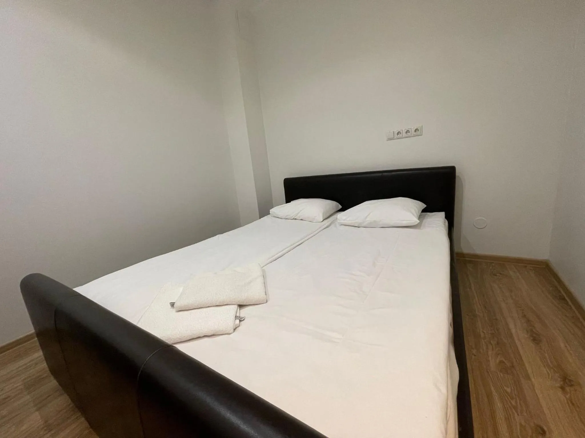 Bed in Yoga Residence Apartments