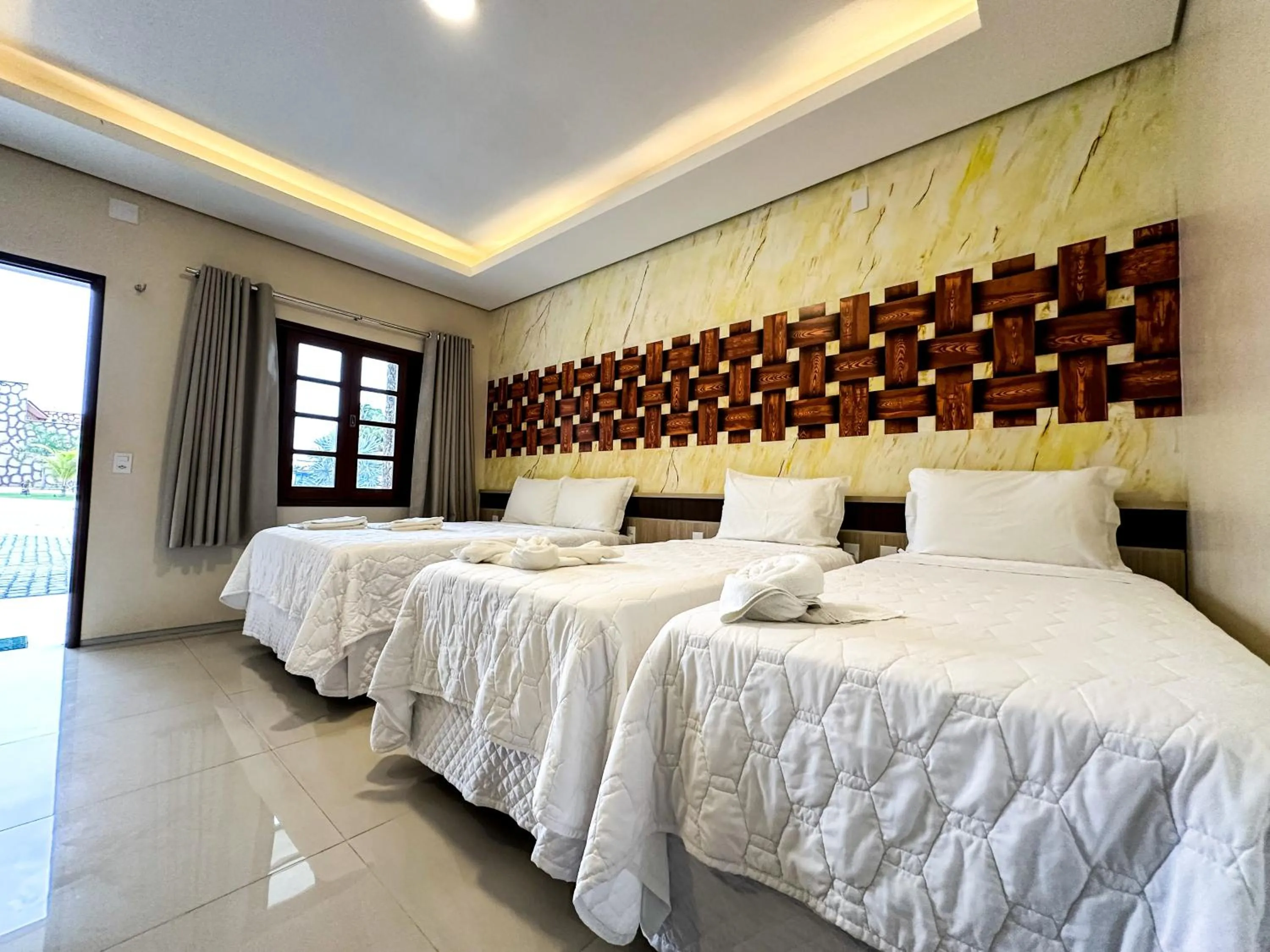 Bed in Pousada Lençóis Maranhenses