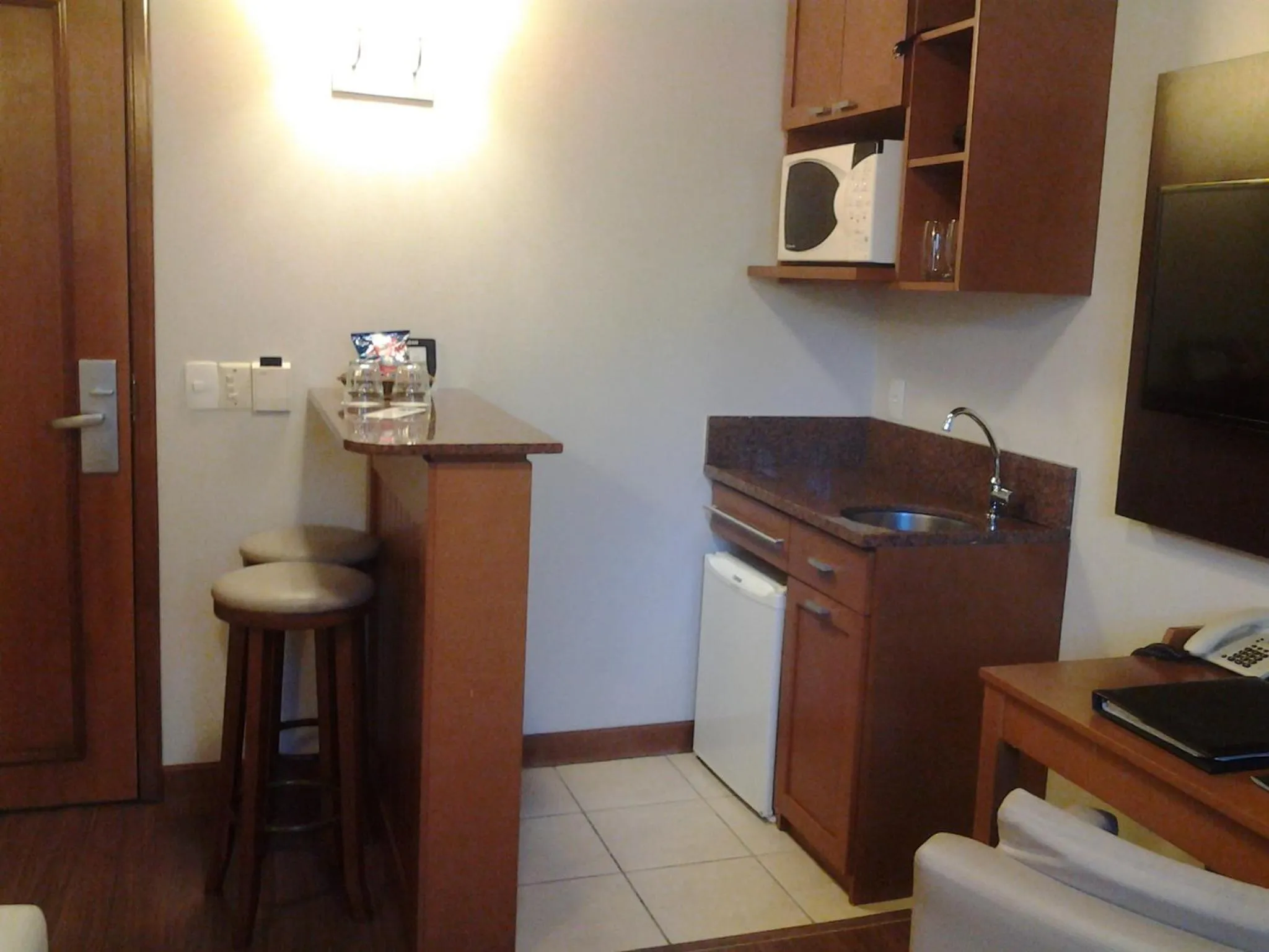 Kitchen or kitchenette in Flat em Gramado