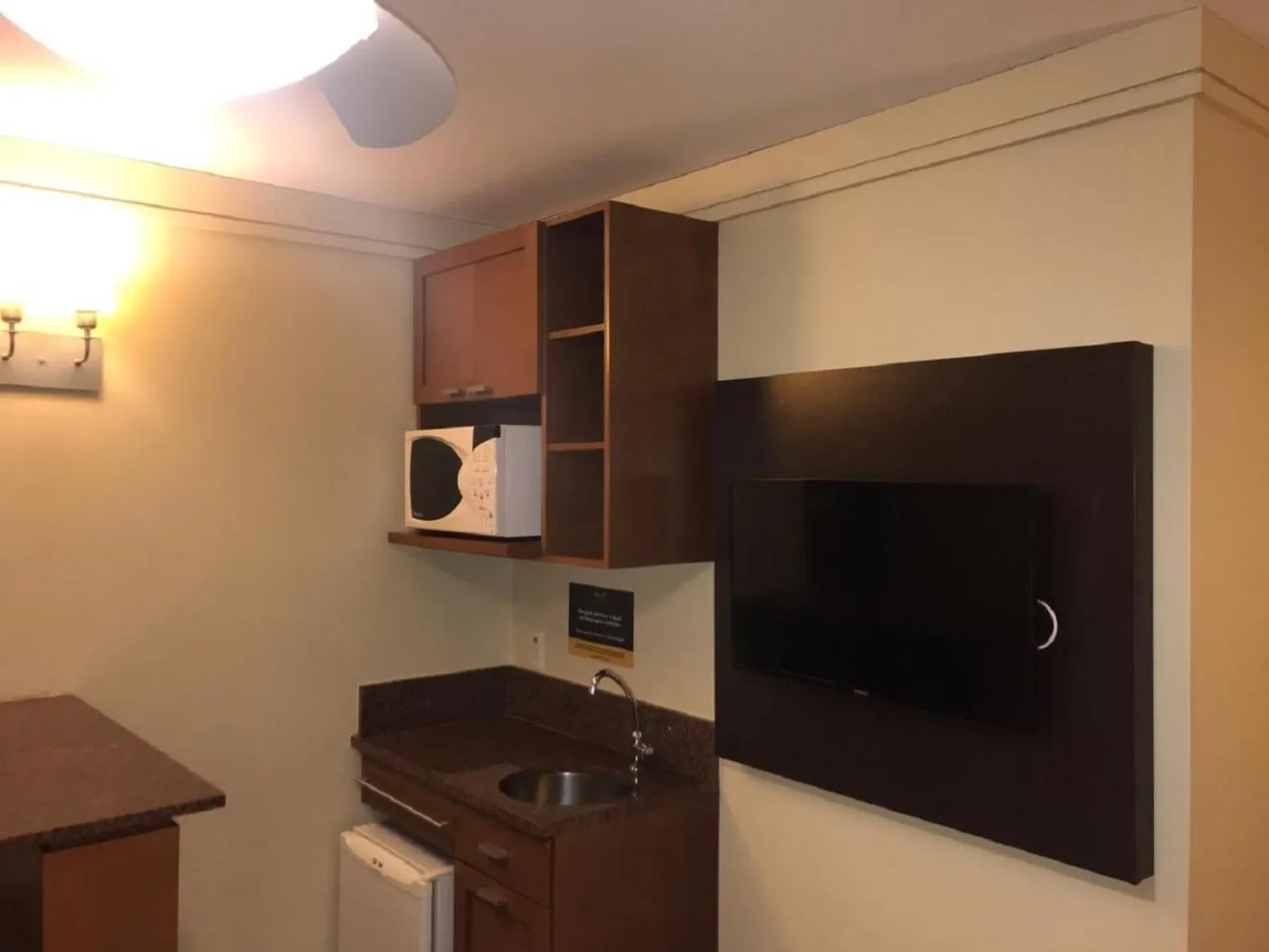 Communal lounge/ TV room in Flat em Gramado