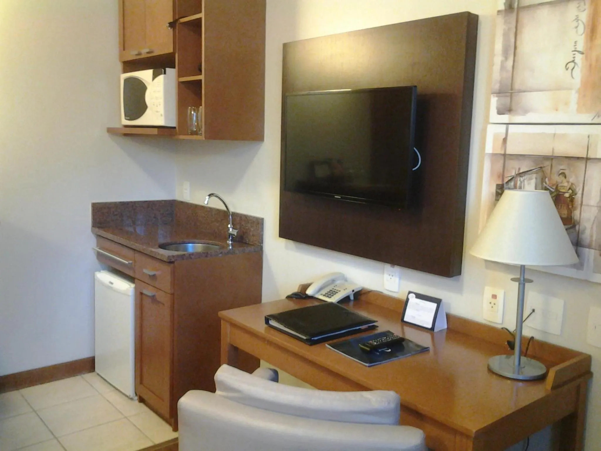 Kitchen or kitchenette in Flat em Gramado