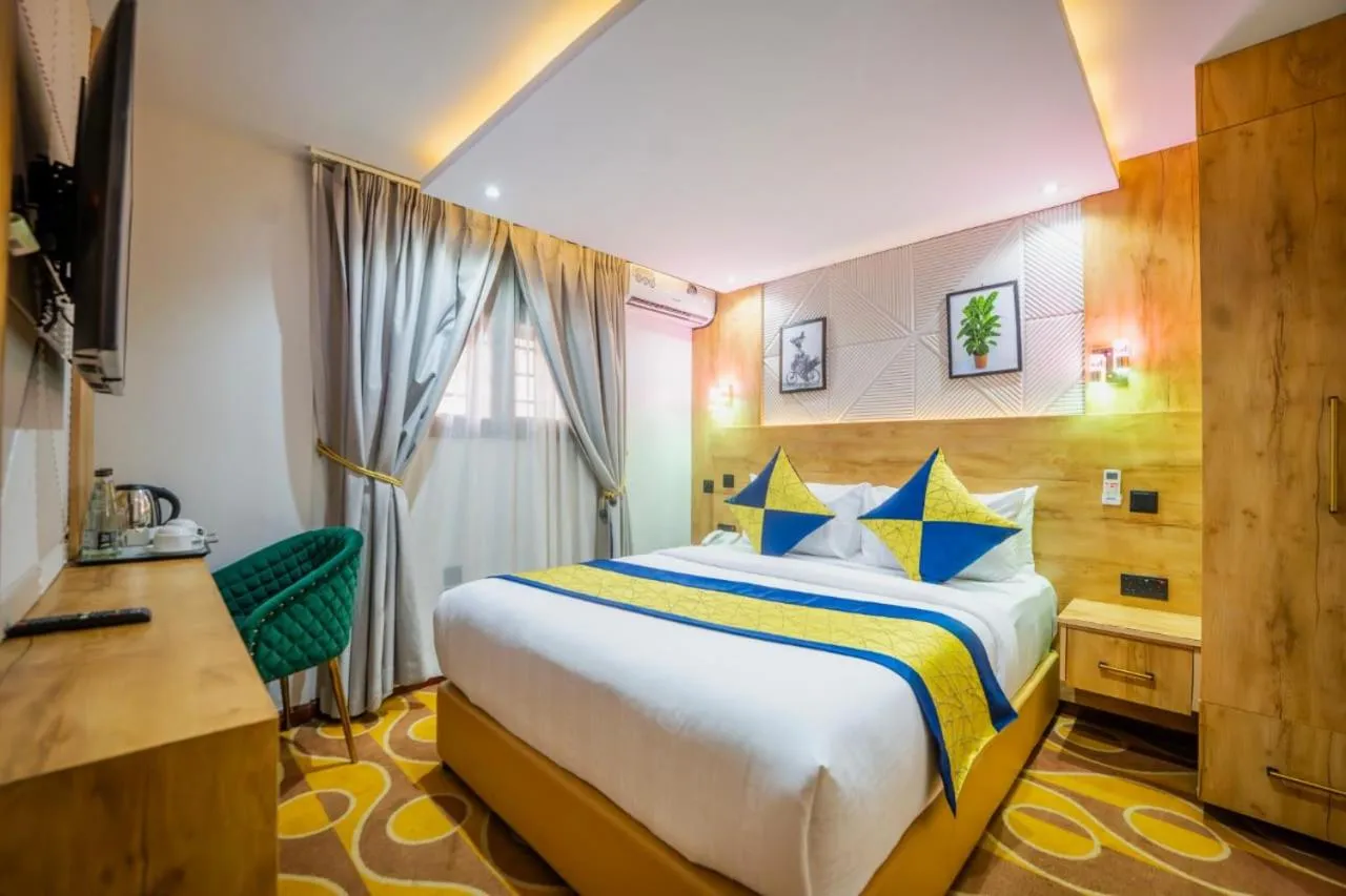 Bed in Afro Park Hotel