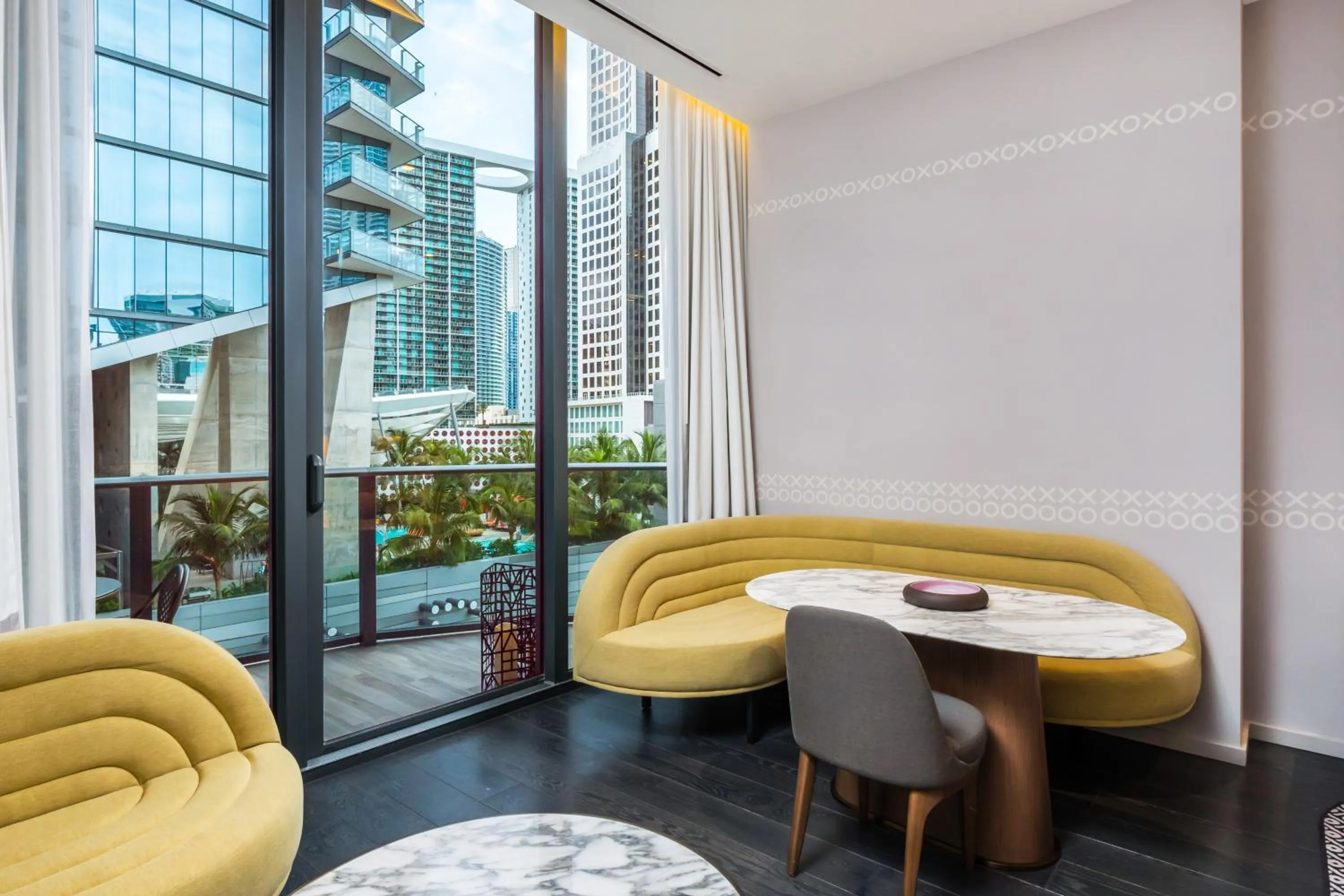 Seating area in Suites at SLS Lux Brickell managed by CE