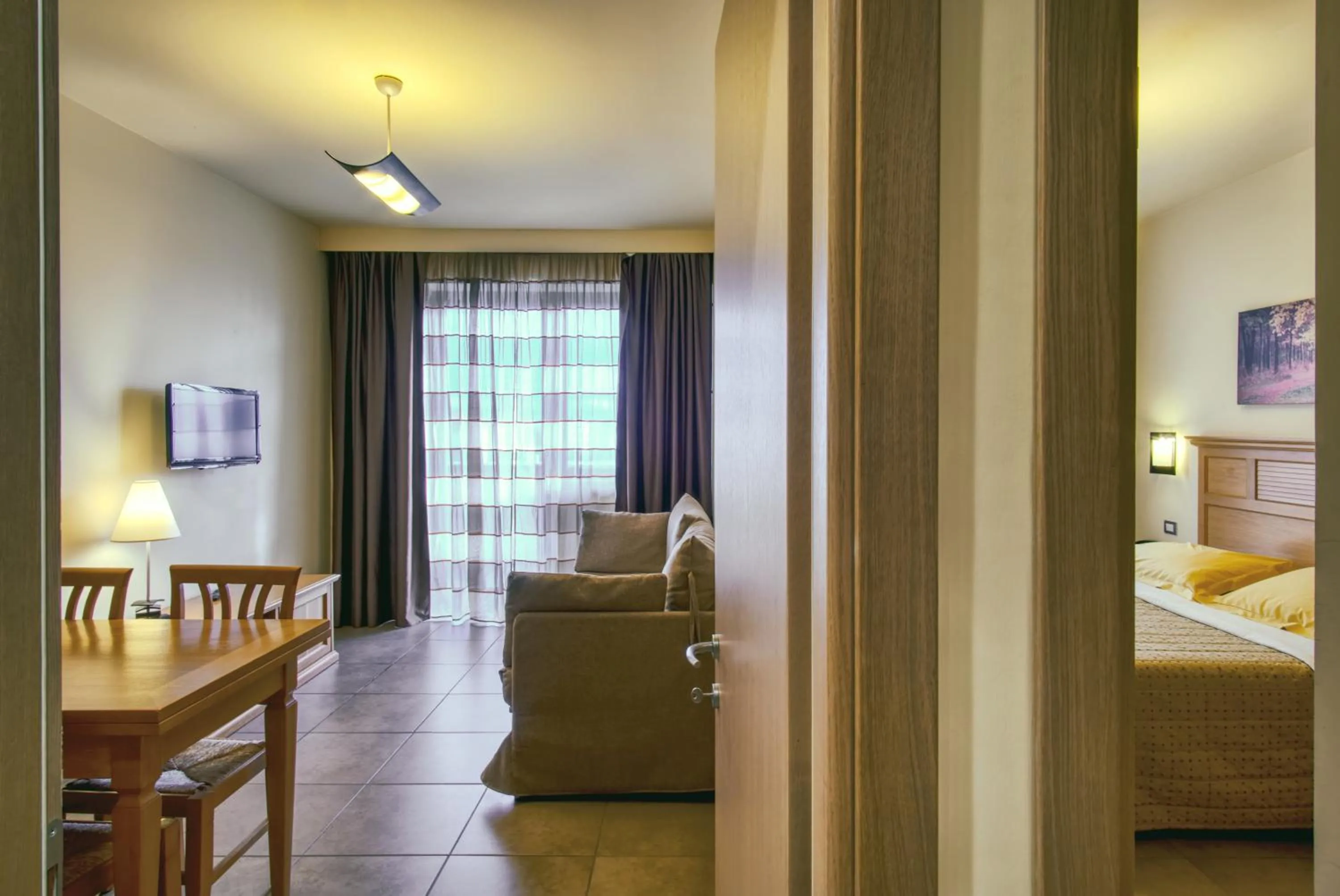 Living room, Bed in Hotel Caesar Residence & SPA