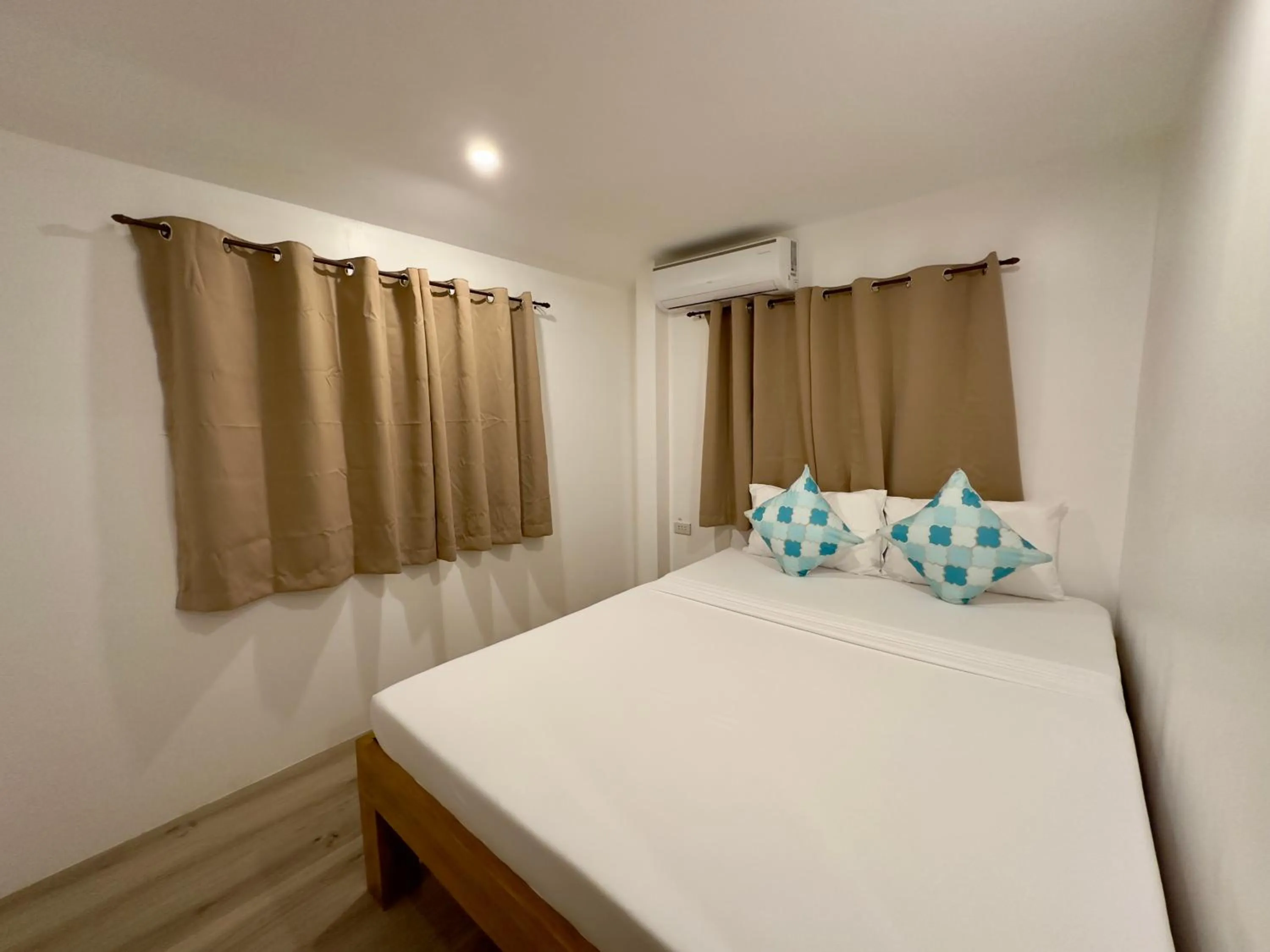 Bed in Palmera El Nido Inn