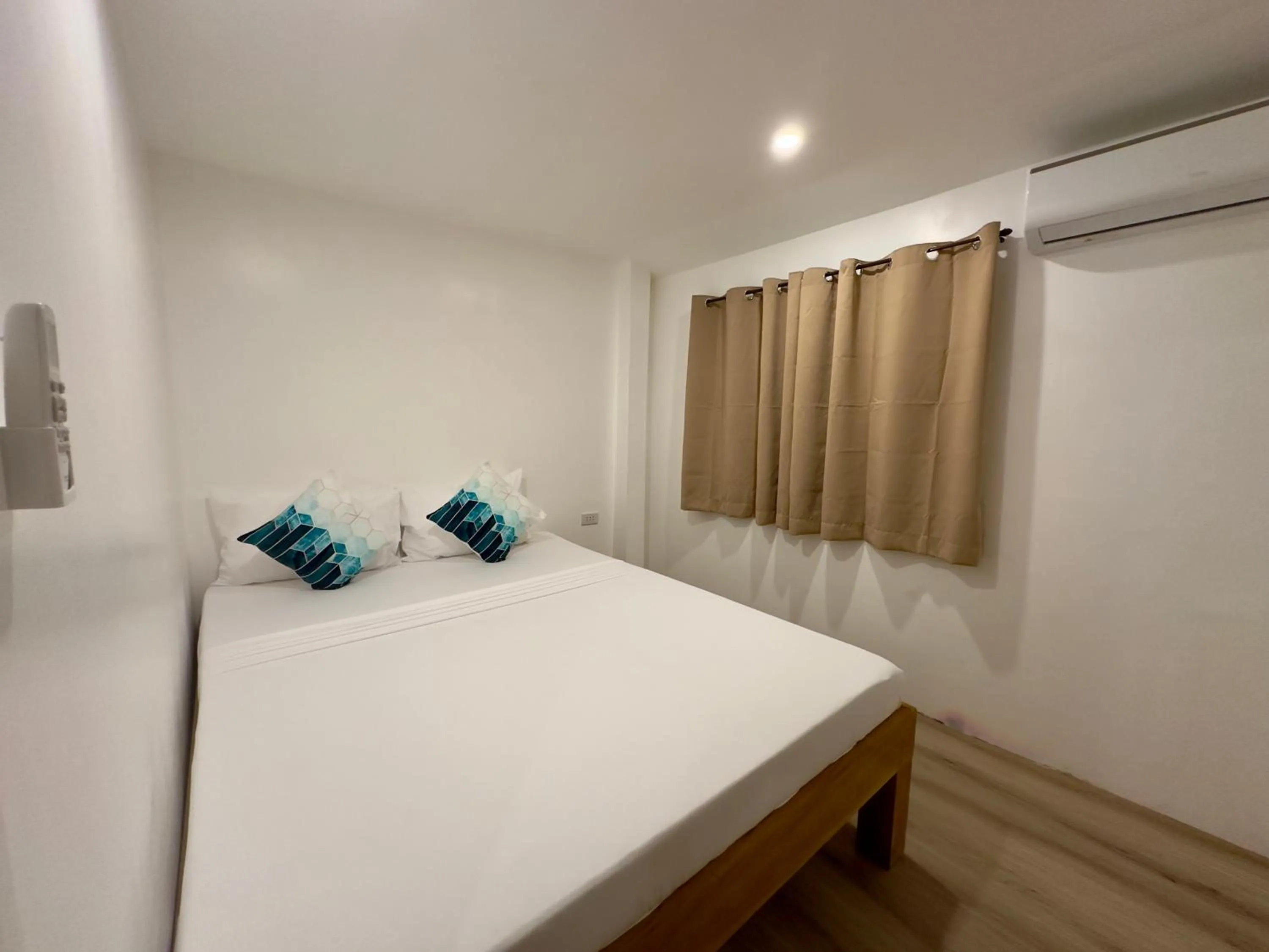 Bed in Palmera El Nido Inn