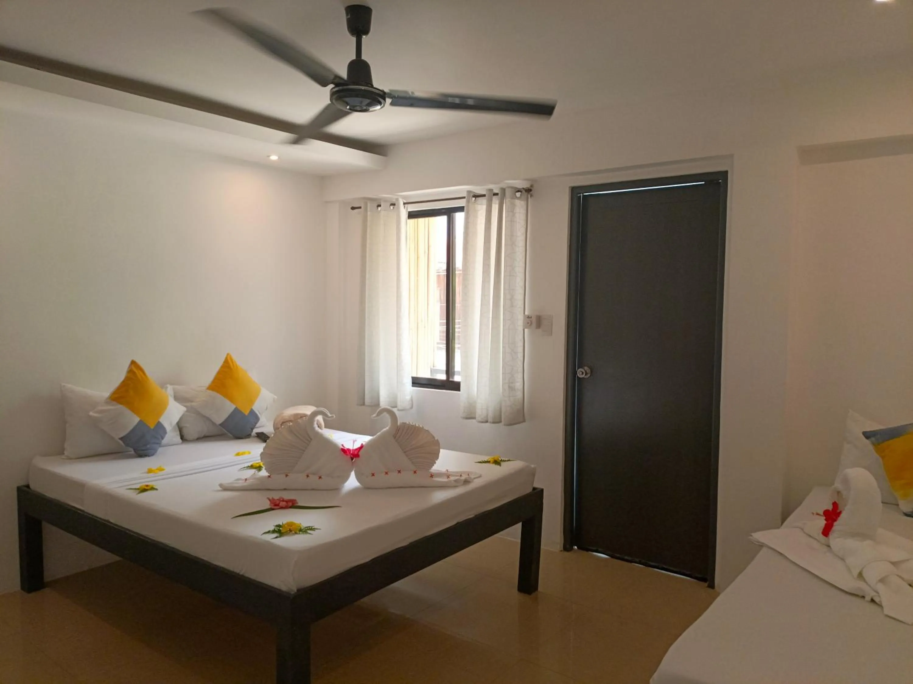 Bed in Palmera El Nido Inn