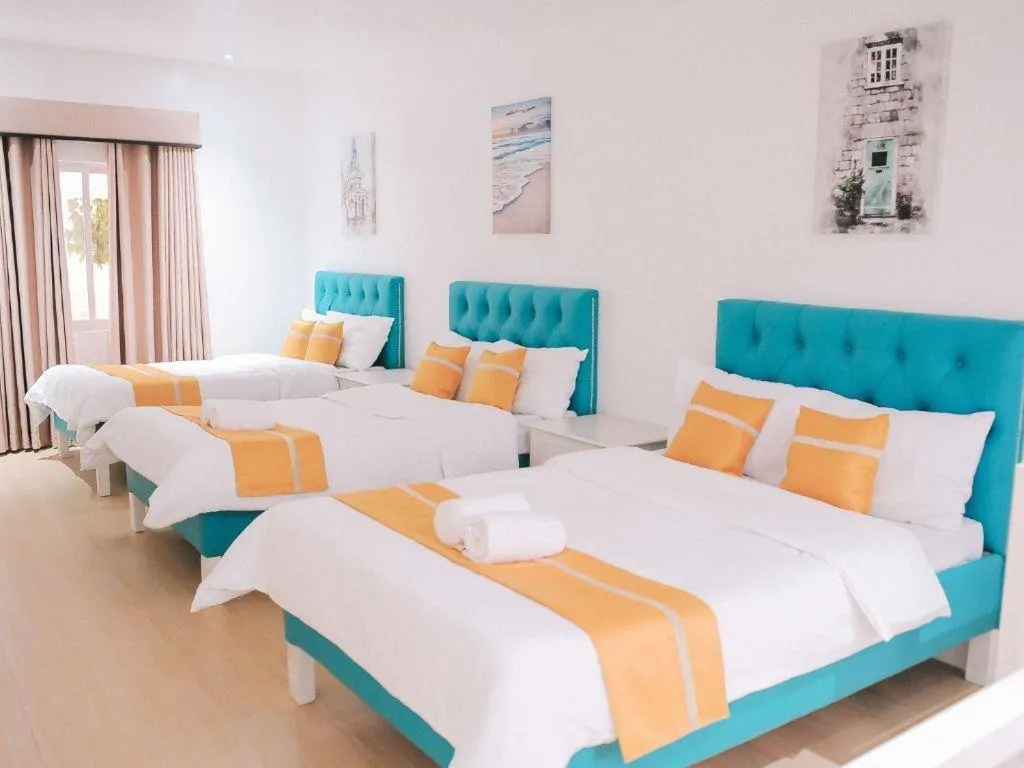 Bed in Villa Excellance Beach and Wave Pool Resort