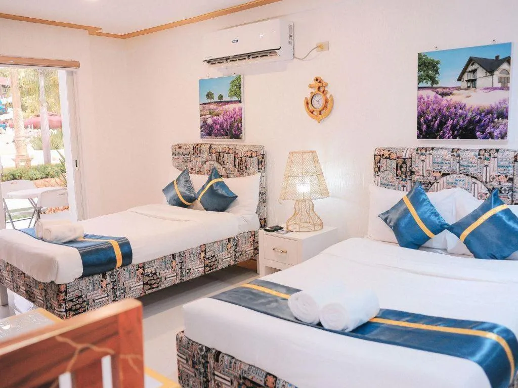 Bed in Villa Excellance Beach and Wave Pool Resort