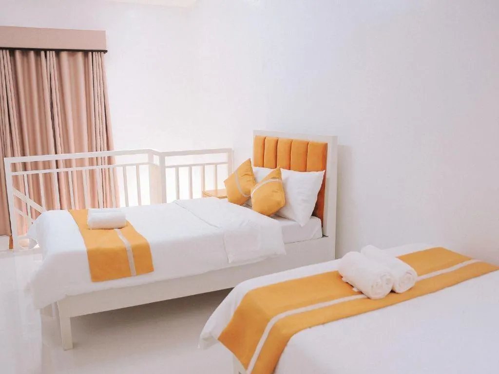 Bed in Villa Excellance Beach and Wave Pool Resort
