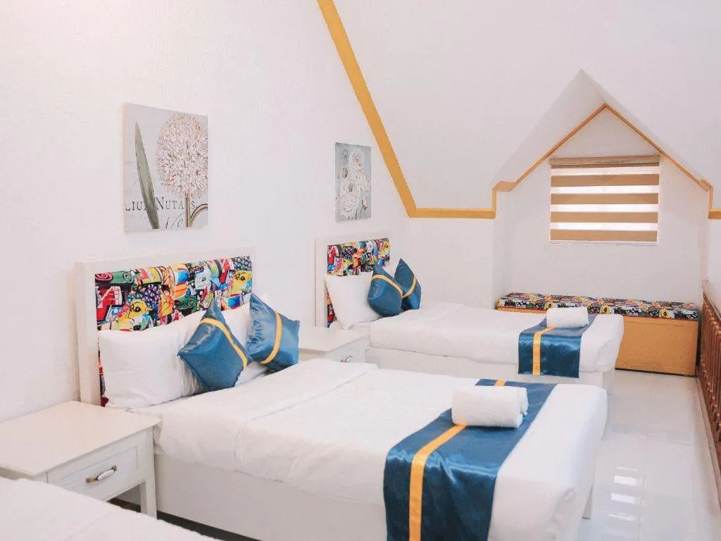 Bed in Villa Excellance Beach and Wave Pool Resort