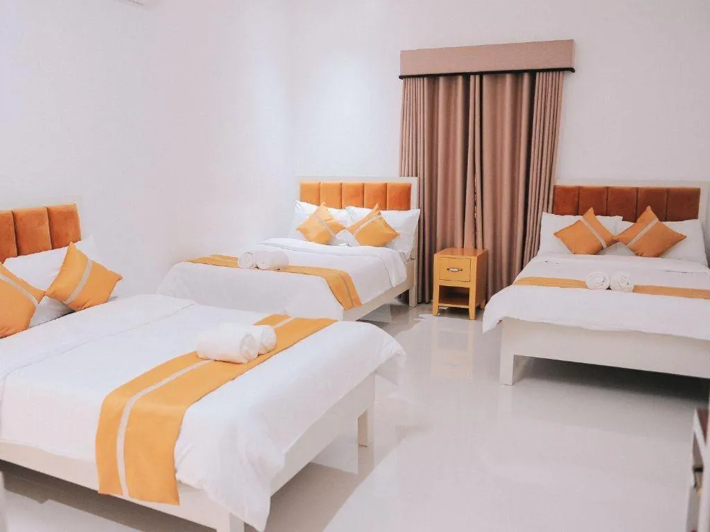 Bed in Villa Excellance Beach and Wave Pool Resort