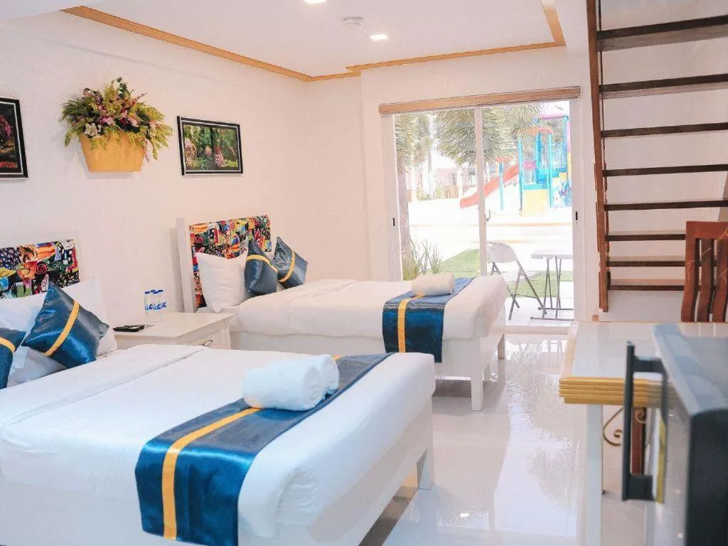 Bed in Villa Excellance Beach and Wave Pool Resort