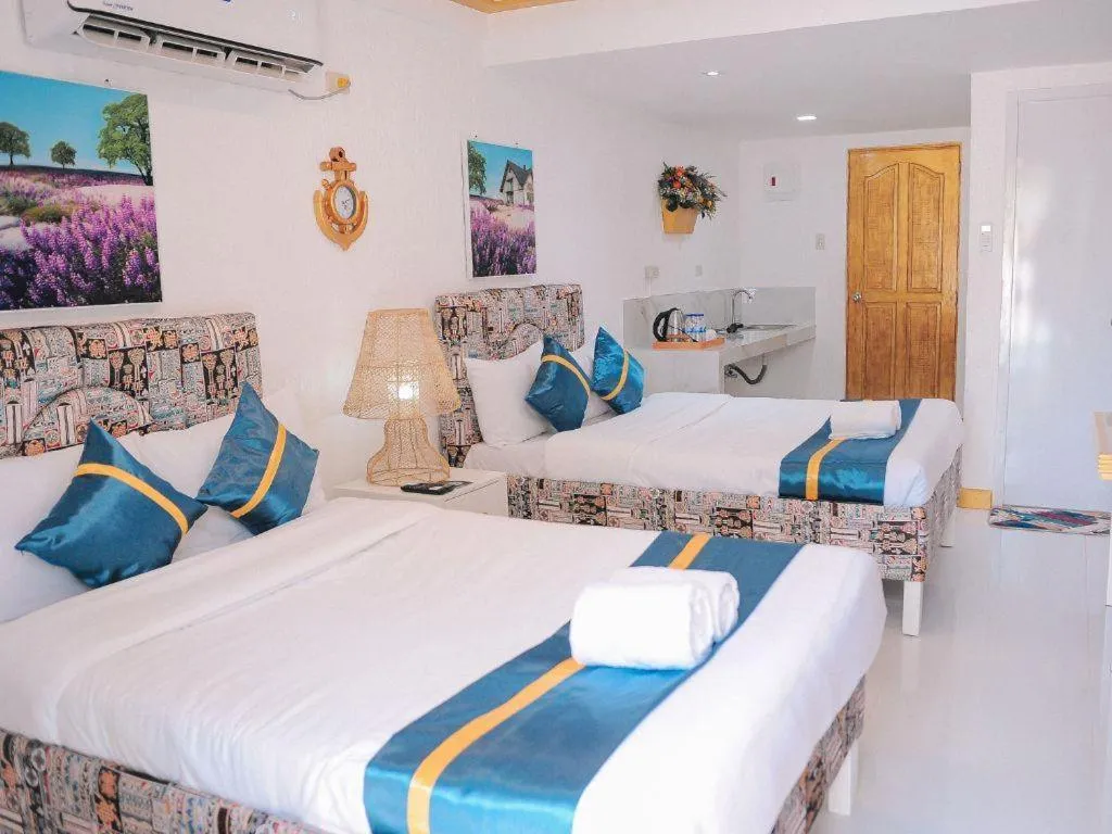 Bed in Villa Excellance Beach and Wave Pool Resort