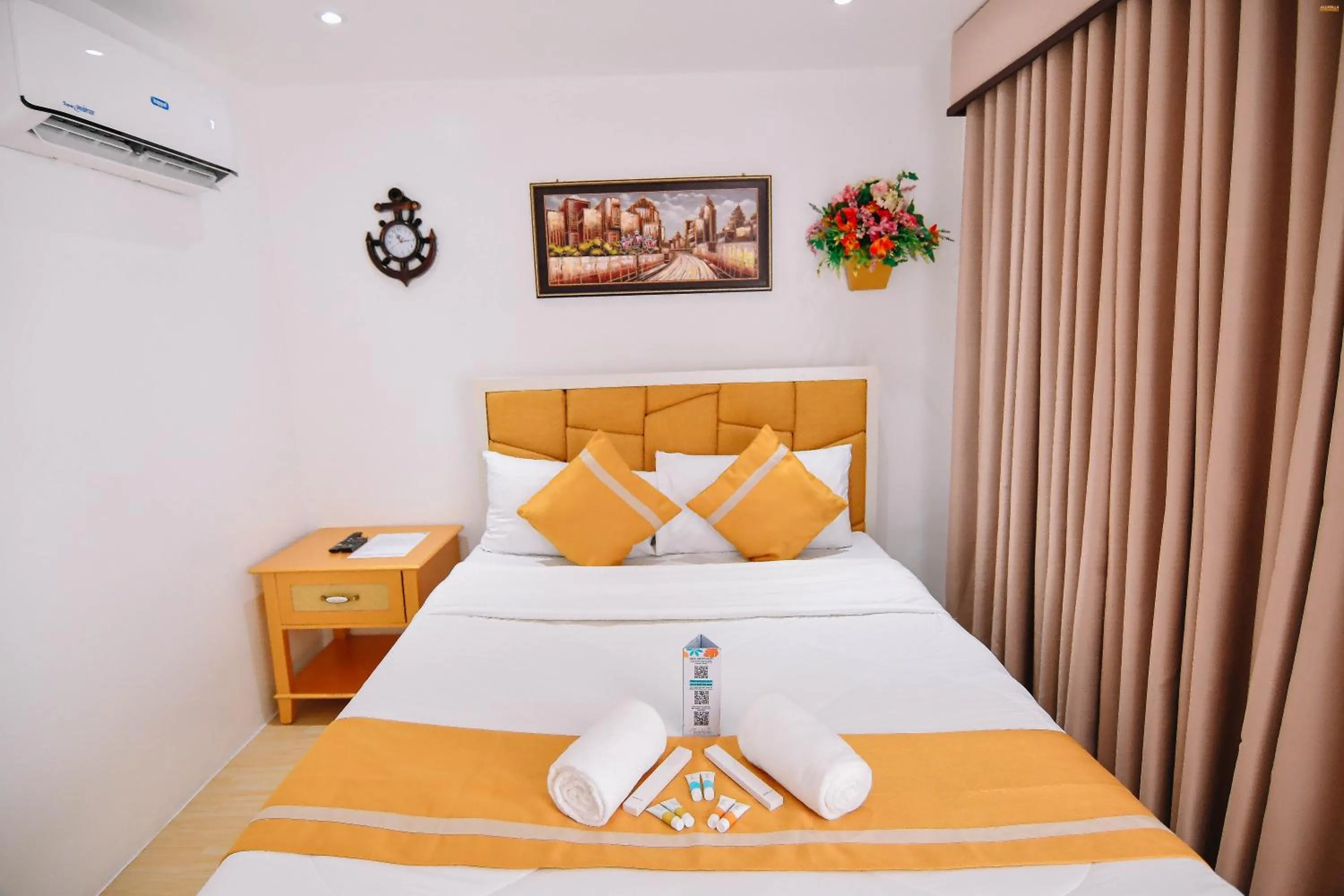 Bed in Villa Excellance Beach and Wave Pool Resort
