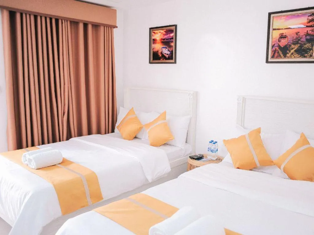 Bed in Villa Excellance Beach and Wave Pool Resort