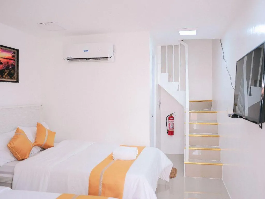 Bed in Villa Excellance Beach and Wave Pool Resort