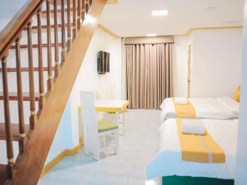 Bed in Villa Excellance Beach and Wave Pool Resort