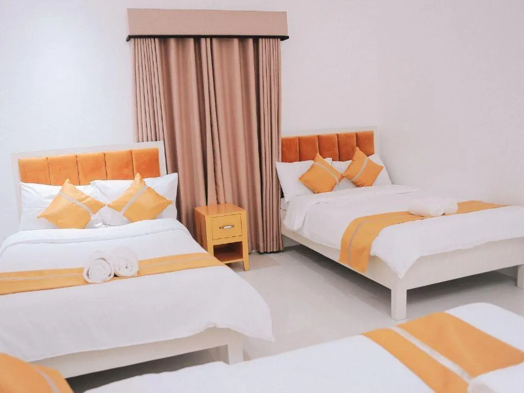 Bed in Villa Excellance Beach and Wave Pool Resort