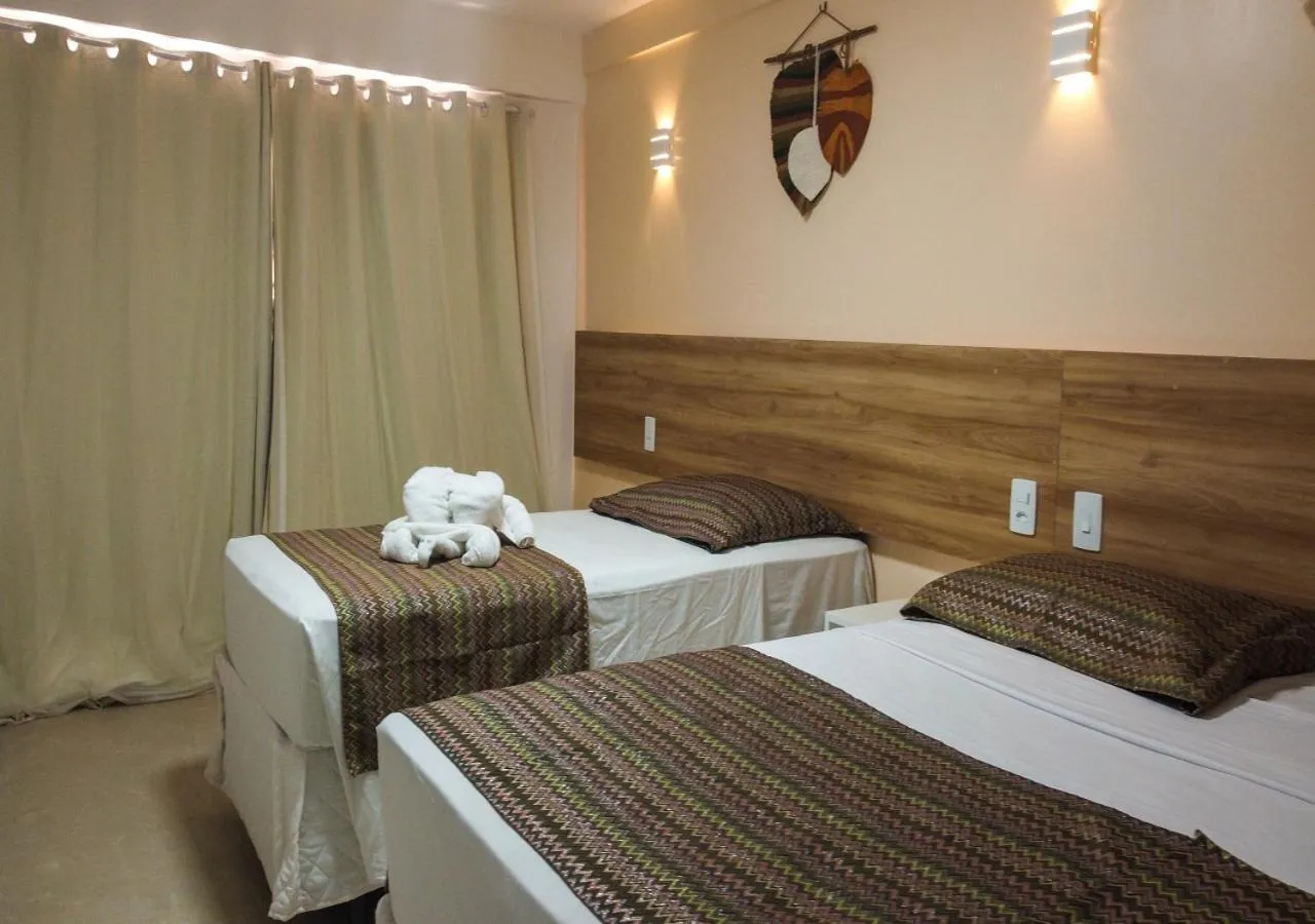 Bed in Pousada Jardins Tropical