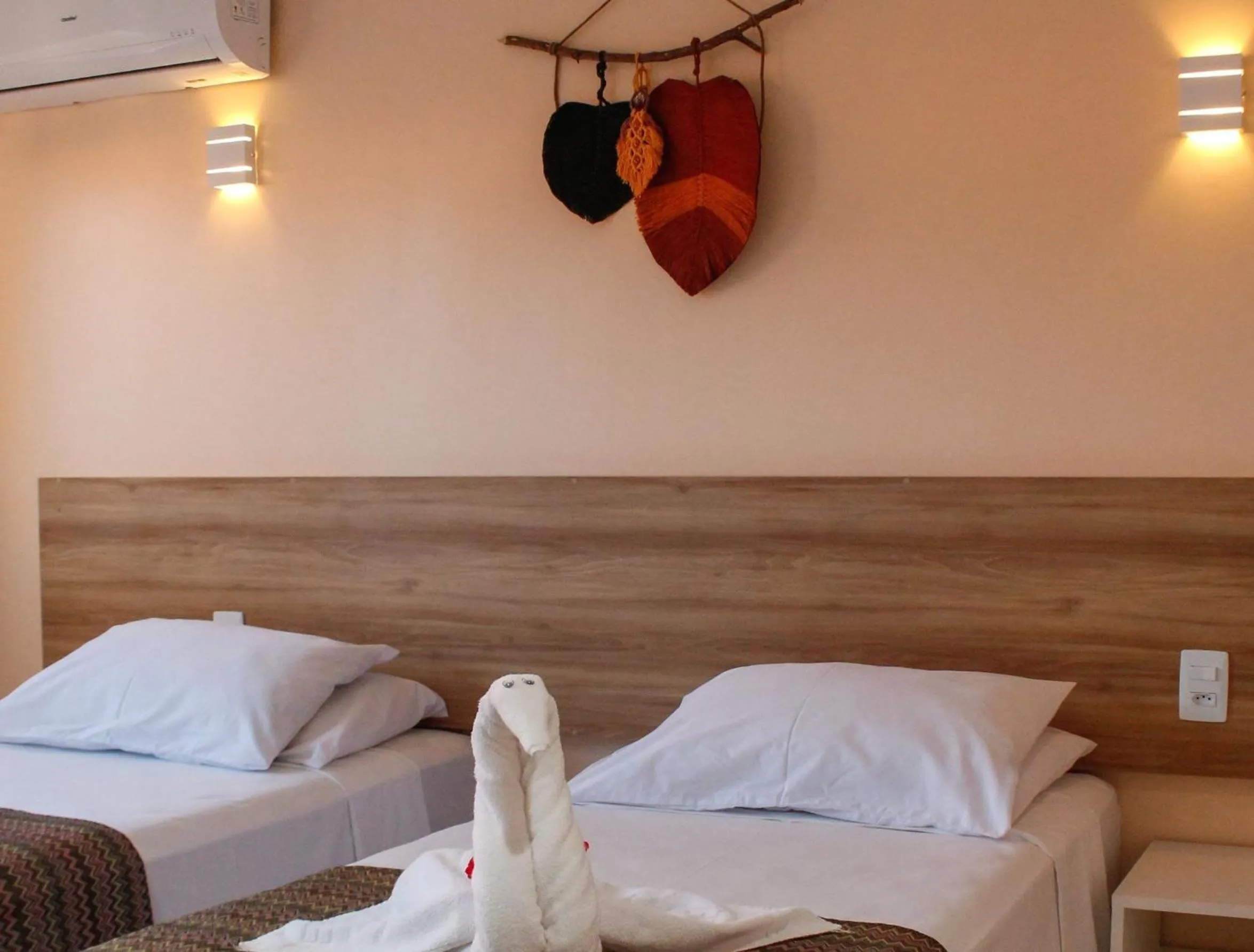 Bed in Pousada Jardins Tropical