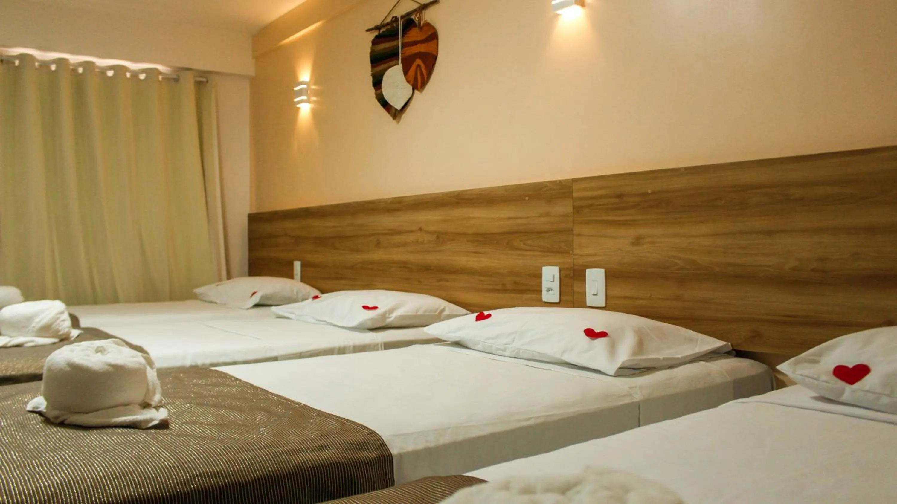 Bed in Pousada Jardins Tropical