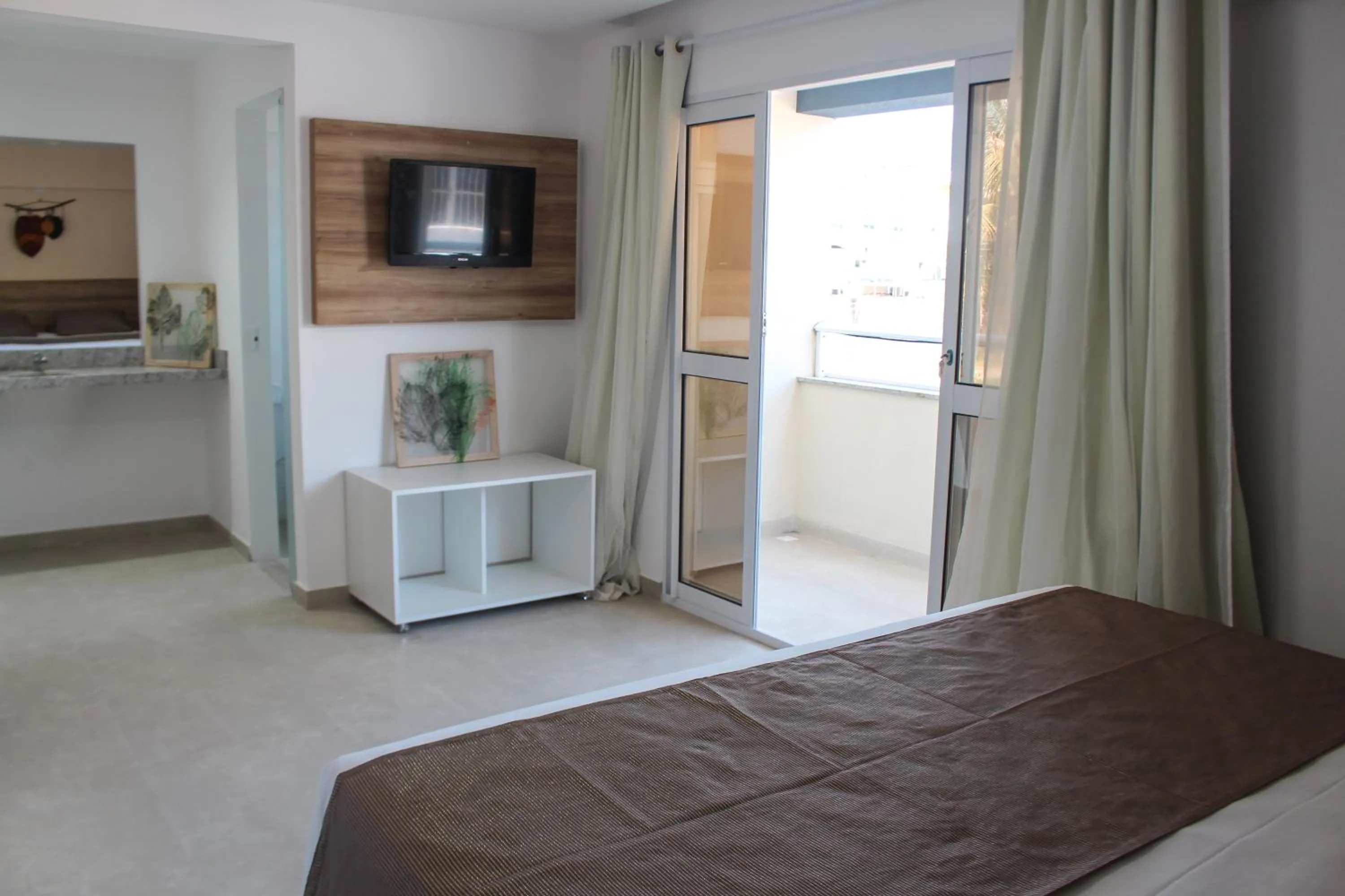 Bed in Pousada Jardins Tropical