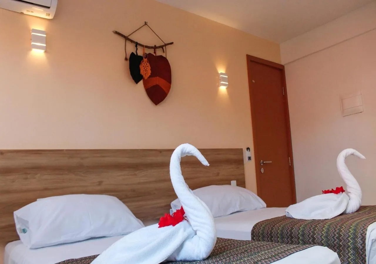 Bed in Pousada Jardins Tropical