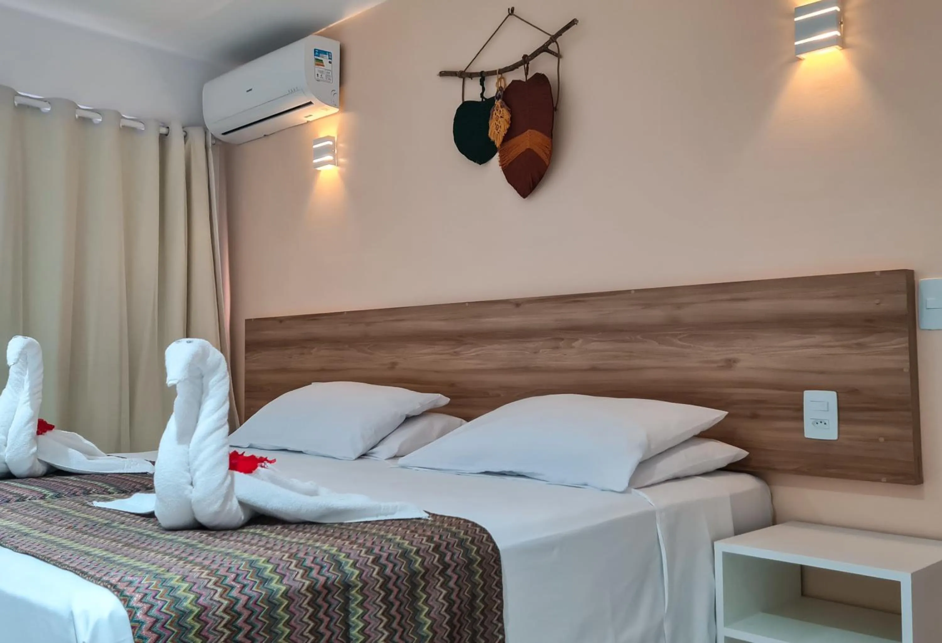 Bed in Pousada Jardins Tropical