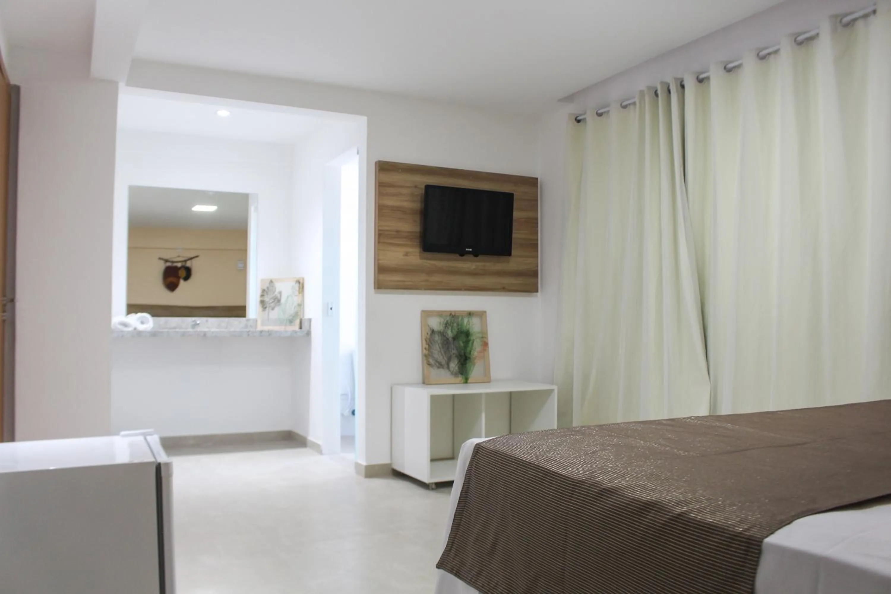 Bed in Pousada Jardins Tropical